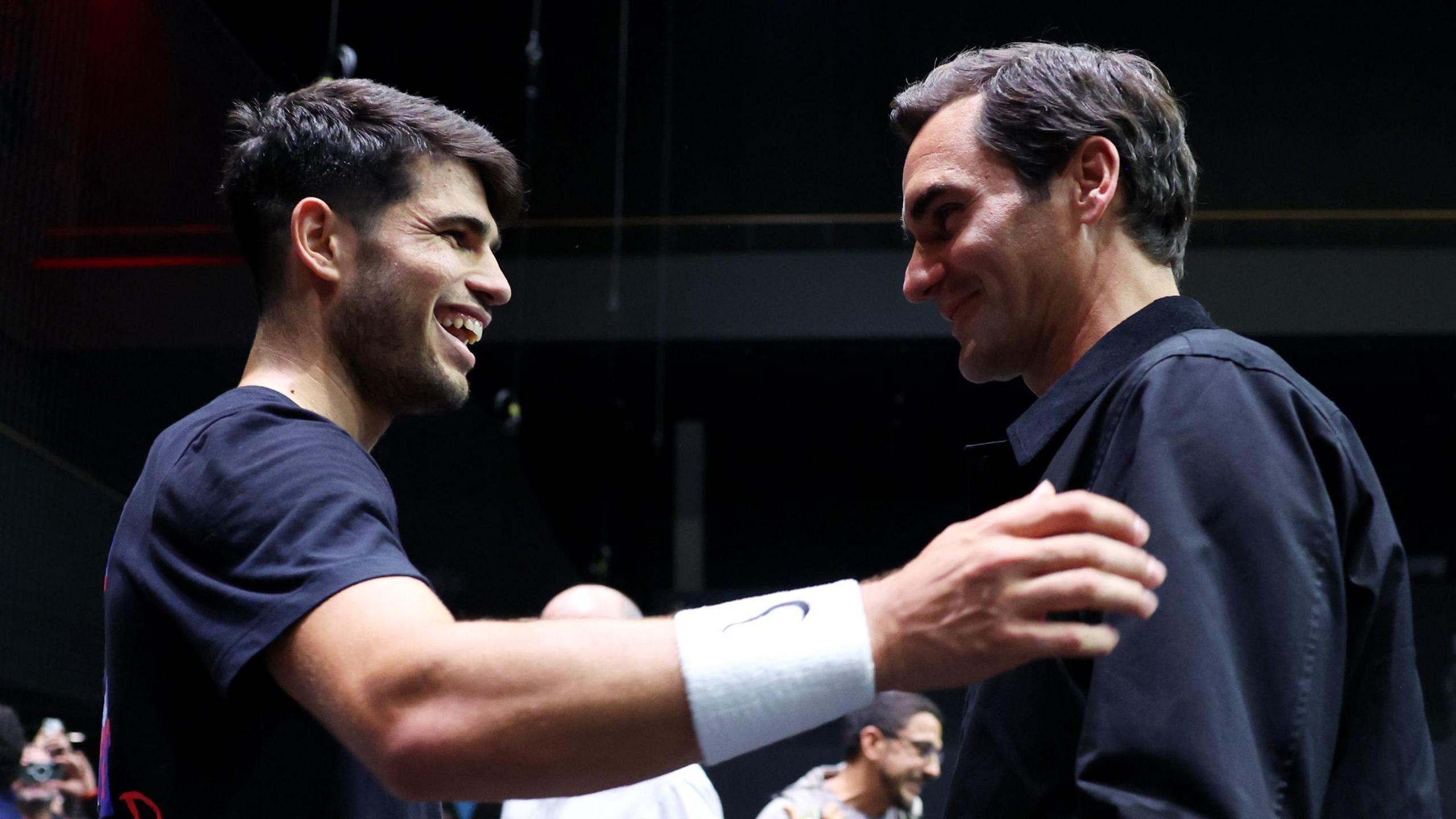 Carlos Alcaraz greets Roger Federer at the 2025 Laver Cup