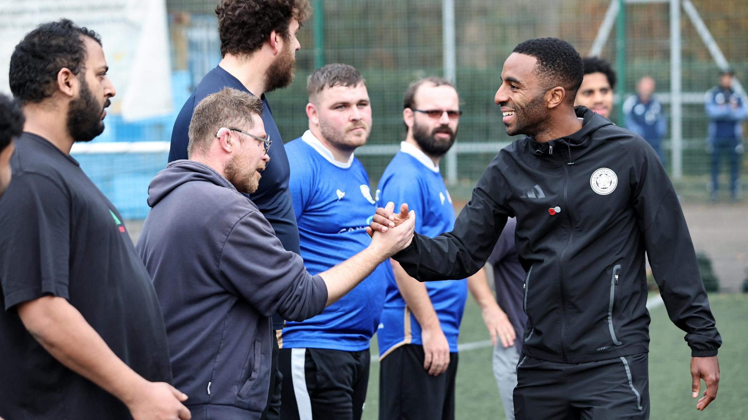 Leicester City captain Ricardo Pereira meets local players at the club's Goal Difference programme