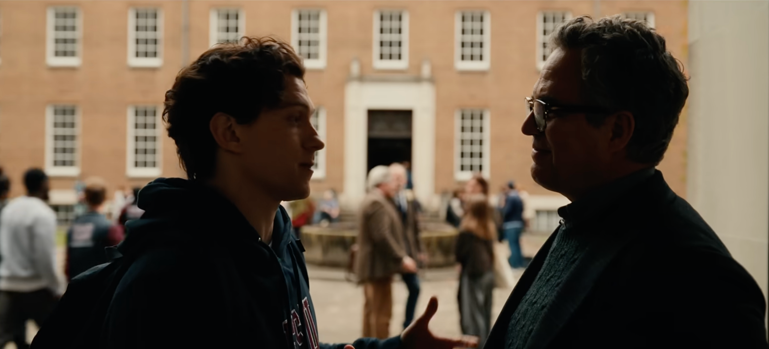 Peter Parker speaking to Bruce Banner in a dark external corridoor, behind them you can see the Hertfordshire County Hall buildings where it was filmed.