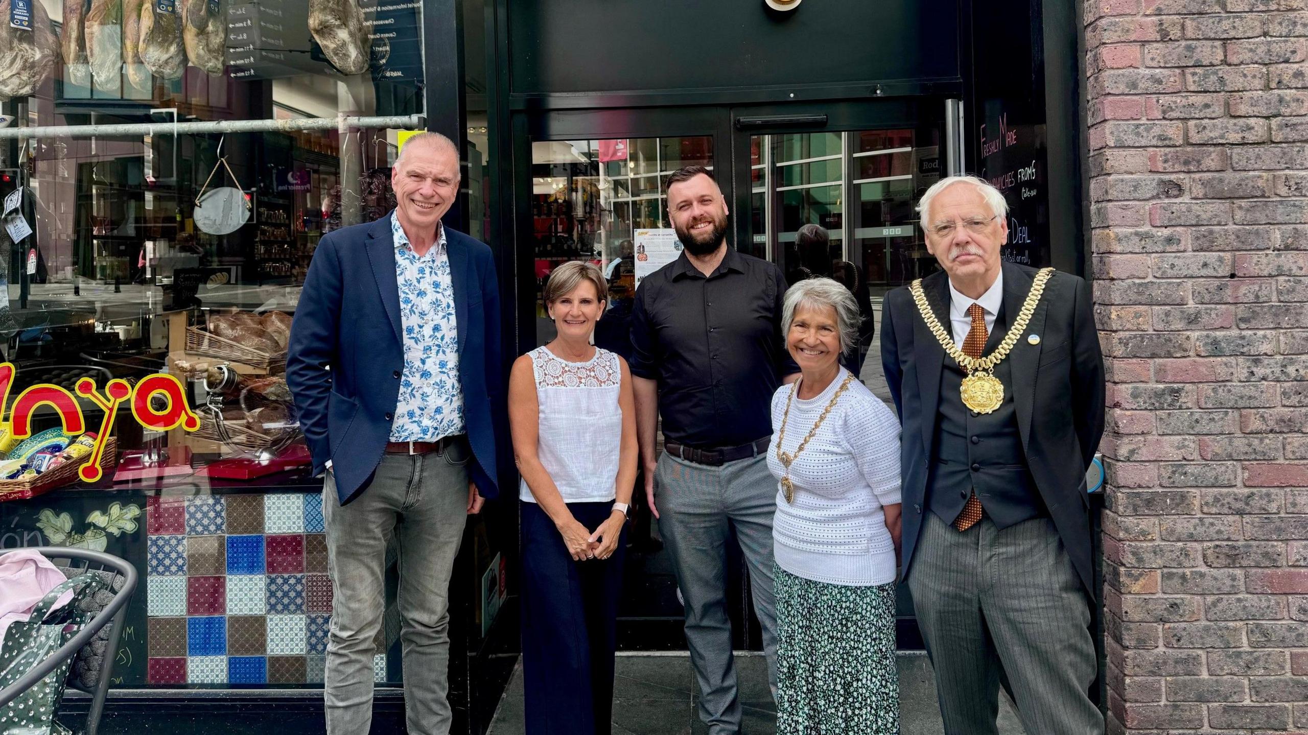 Image shows, from left to right, Peter Kinsella, his wife Elaine, Lunya operations manager Tom Cavanagh, Lord Mayor's Consort Erica Kemp and Lord Mayor of Liverpool Richard Kemp standing outside the Lunya restaurant in Liverpool