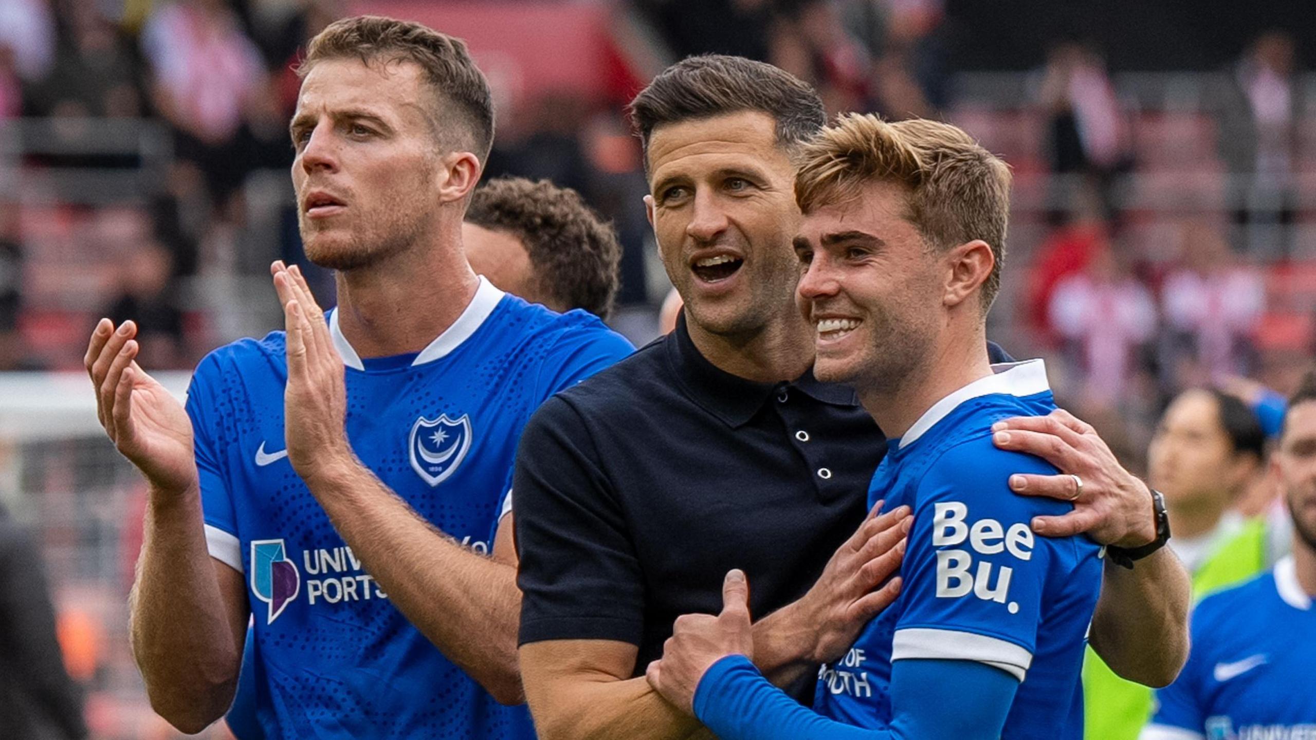 John Mousinho with his Portsmouth players at full-time