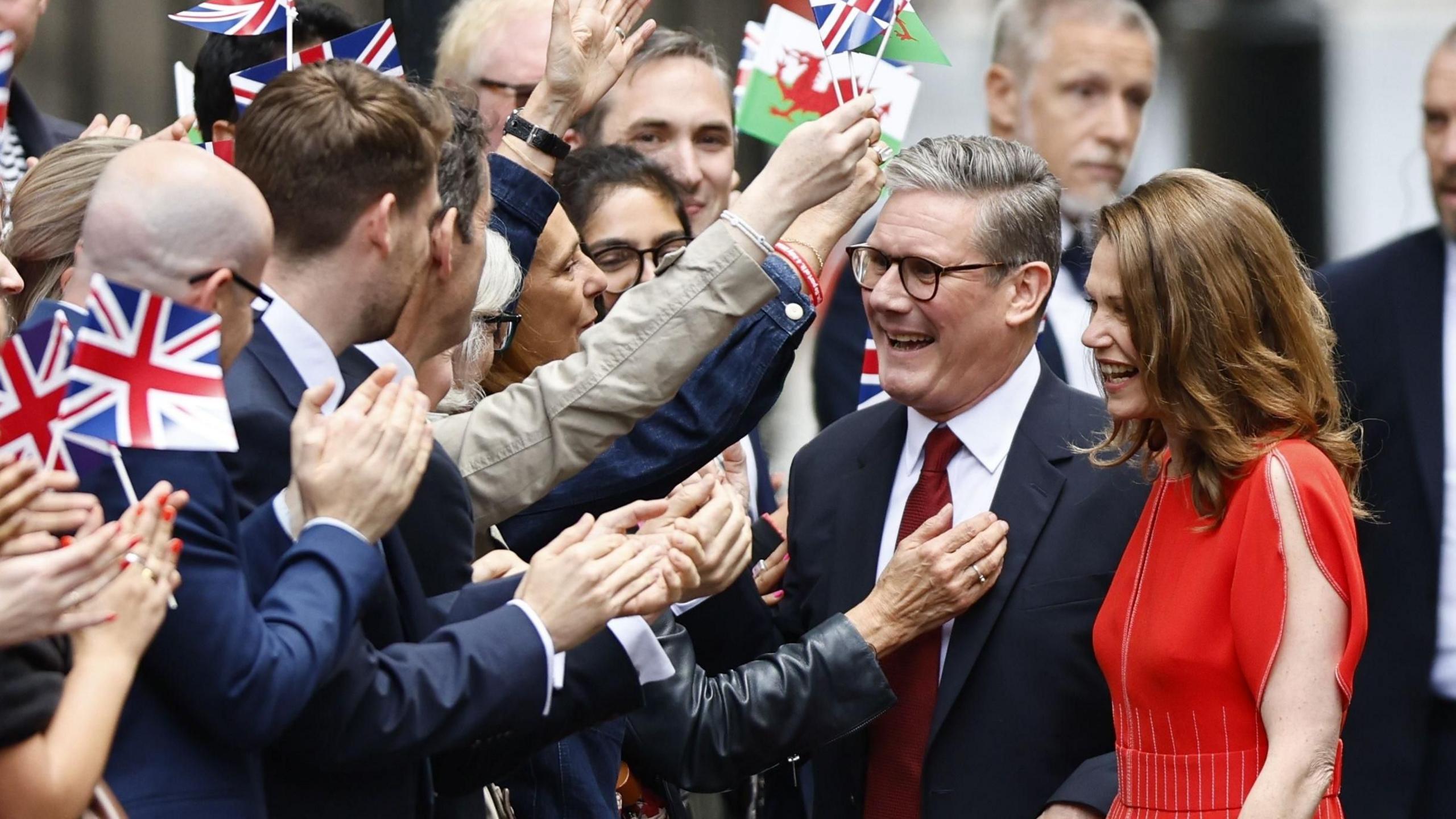 Sir Keir Starmer and his wife Victoria welcoming supporters in Downing Street