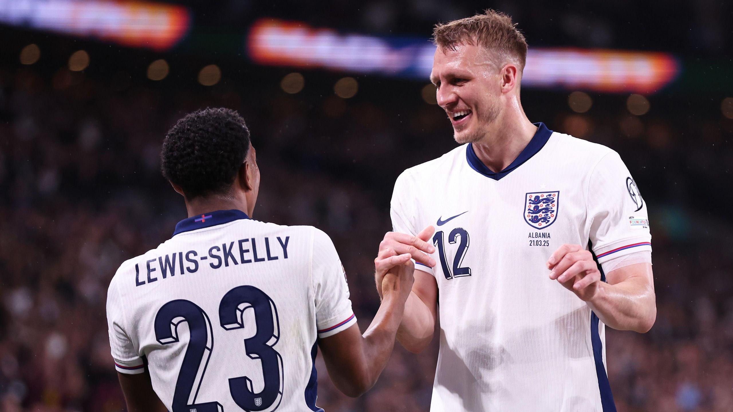 Myles Lewis-Skelly and Dan Burn celebrate the former opening the scoring for England against Albania 