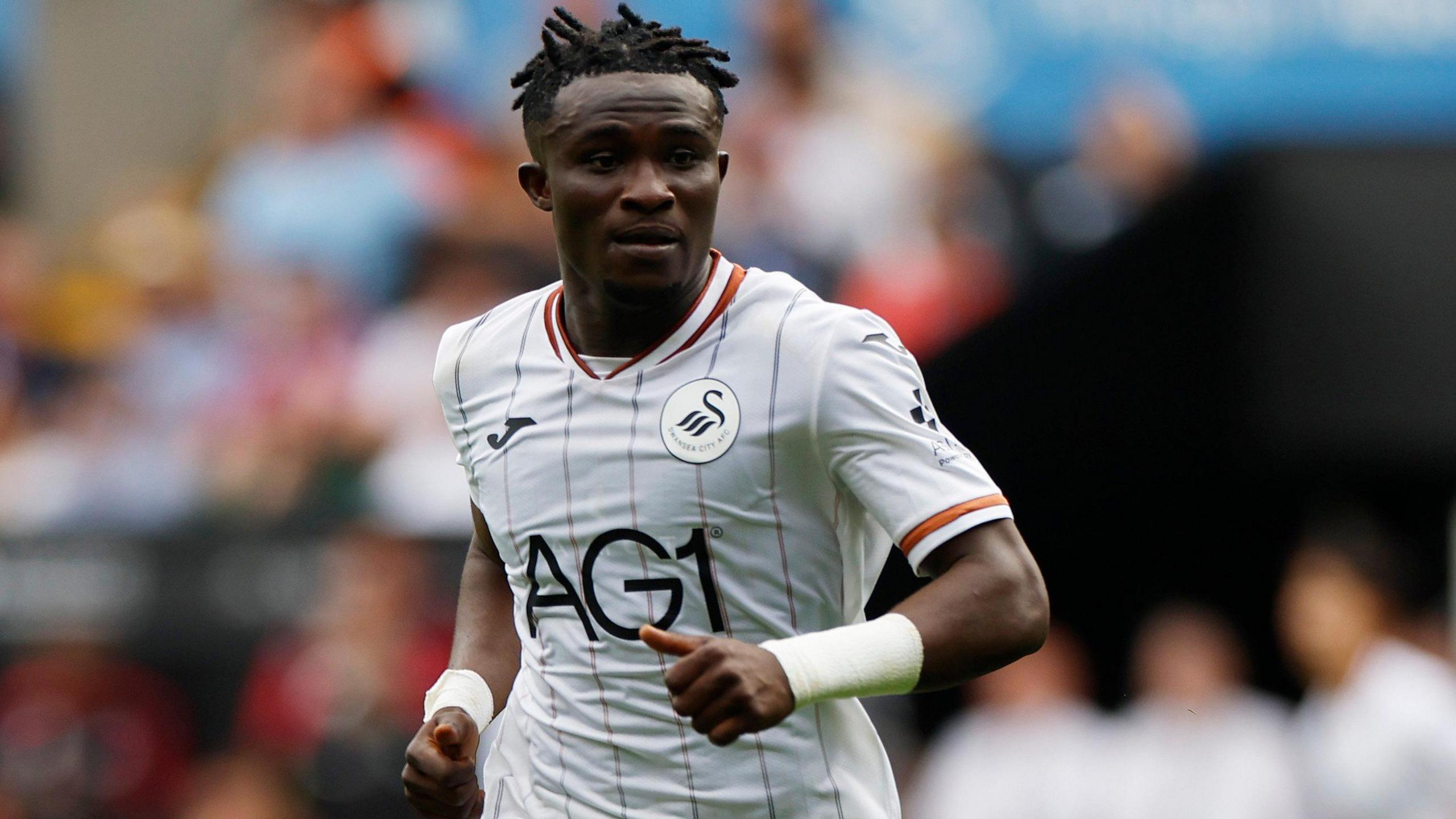Joseph Opoku in action for Swansea against Birmingham