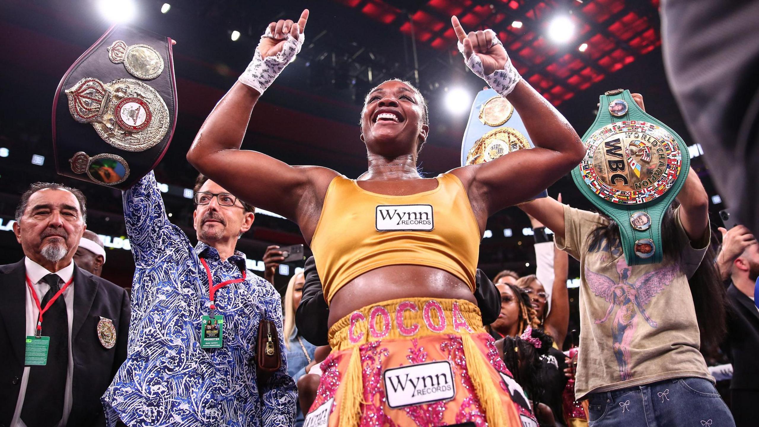 Claressa Shields points to the sky celebrating