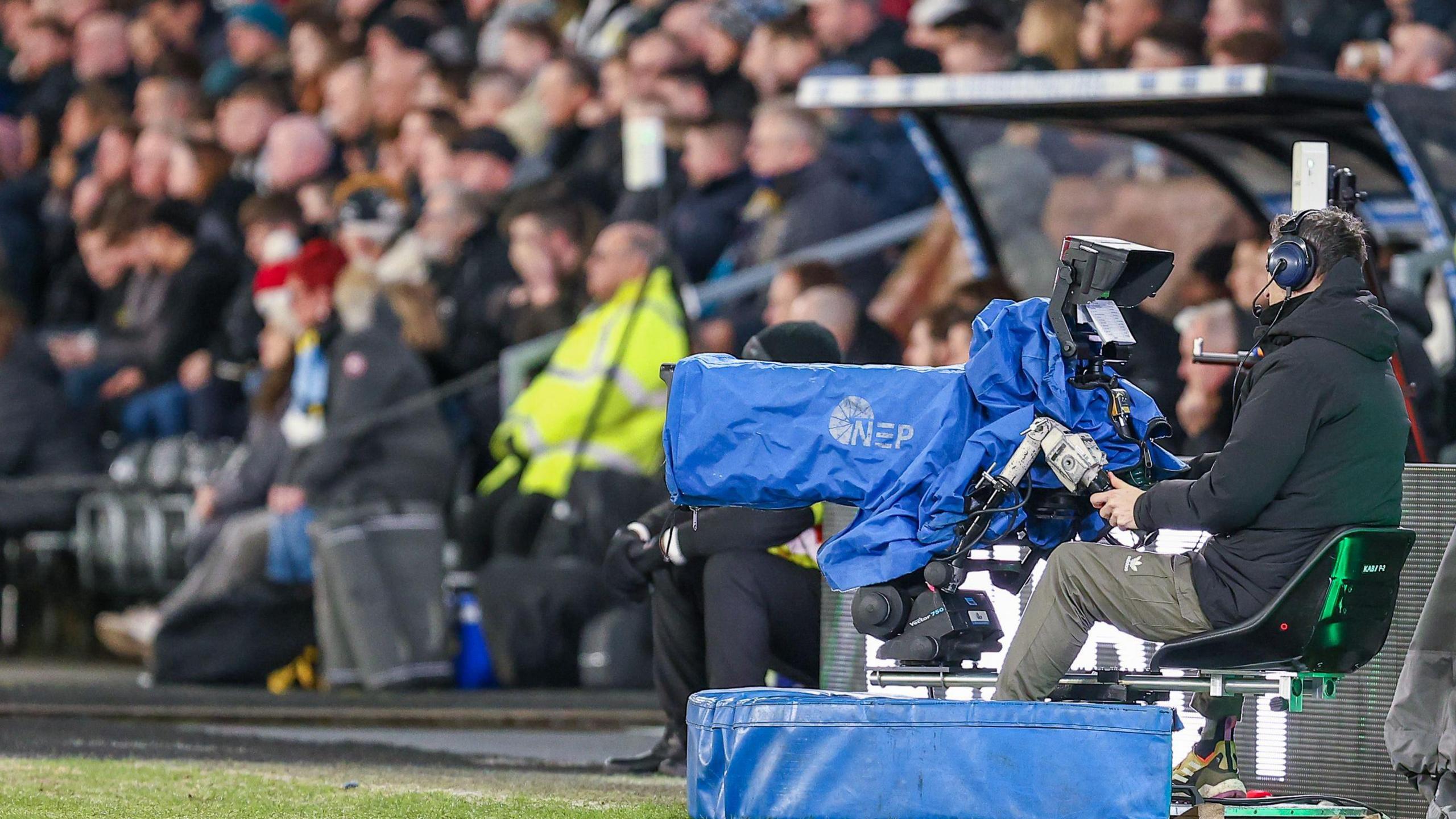 A TV camera at a Leeds United match