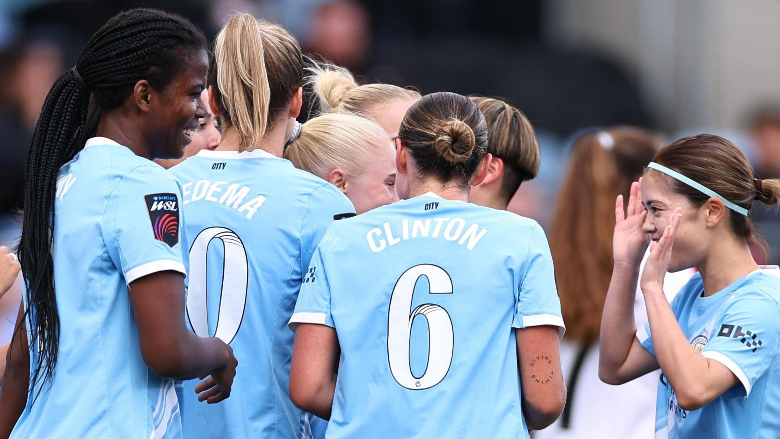 Manchester City's players celebrate their second goal against London City 