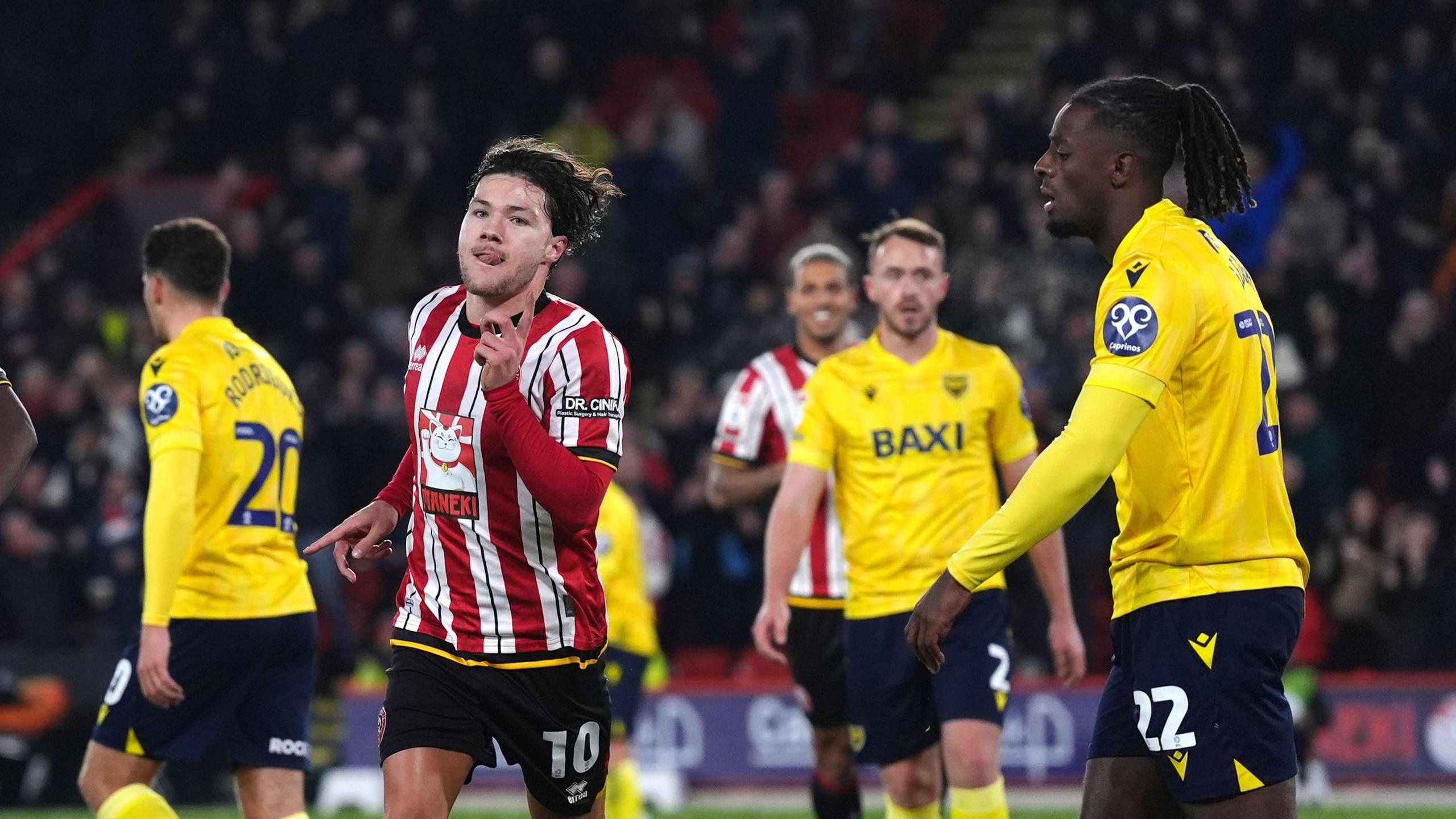 Callum O'Hare celebrating his opening goal for Sheffield United's 3-0 win over Oxford United.