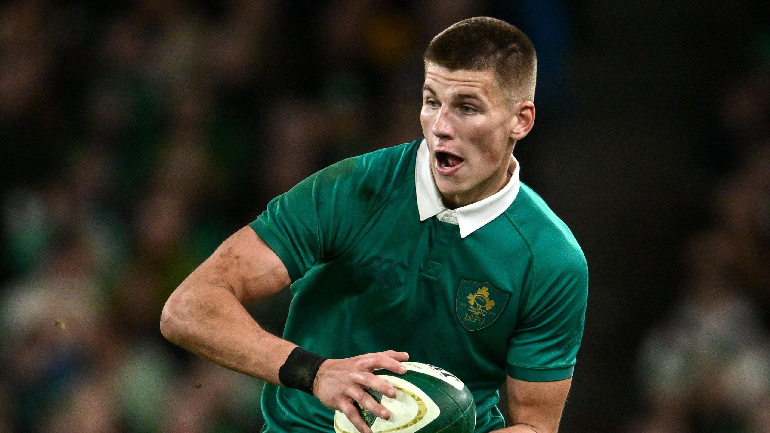 Sam Prendergast runs with the ball during Ireland's win over Australia in November