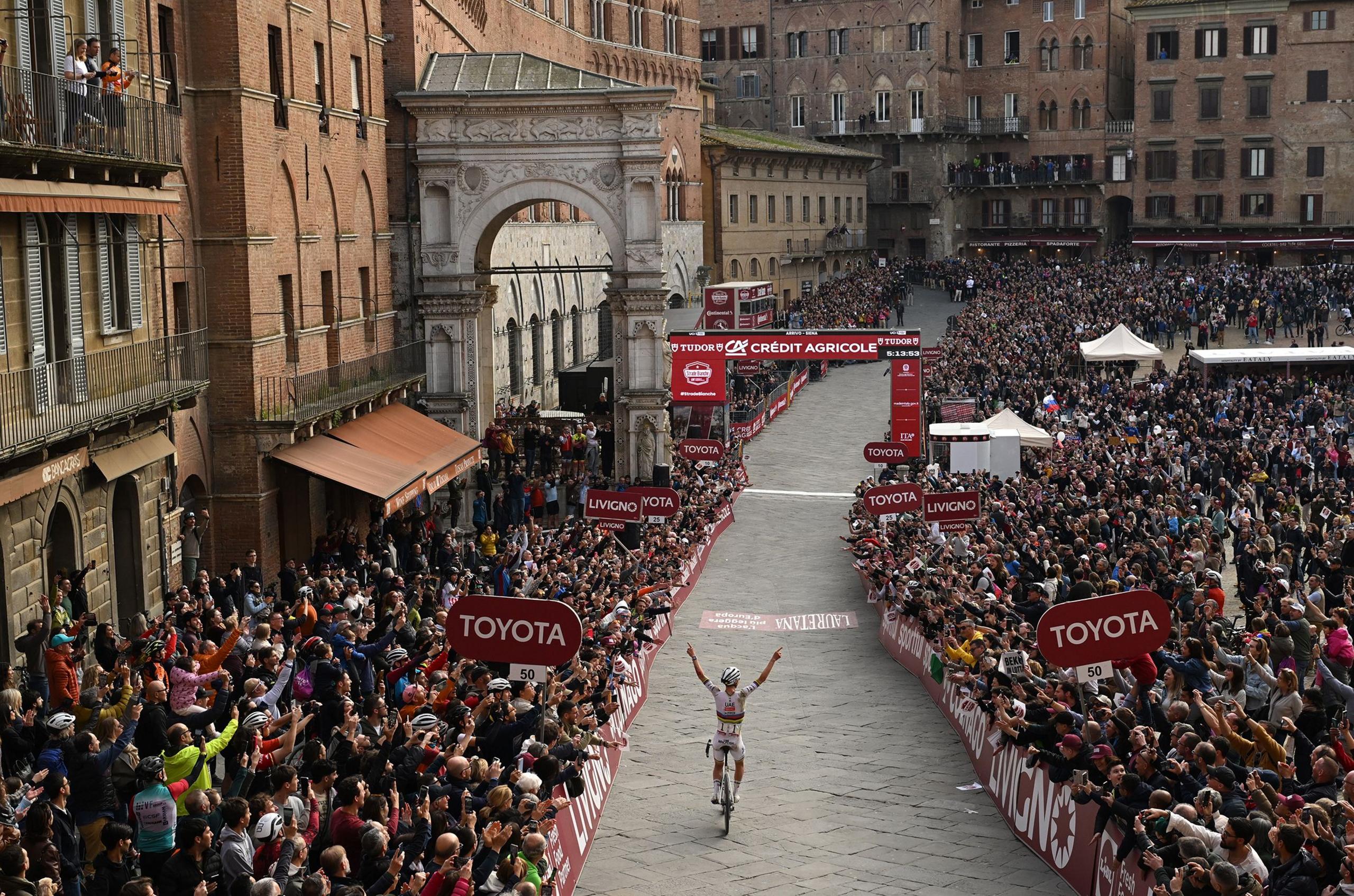 Slovenias Tadej Pogacar celebrates at finish line during the 19th Strade Bianche 2025, Men's Elite a 213km one day race in Siena, Italy