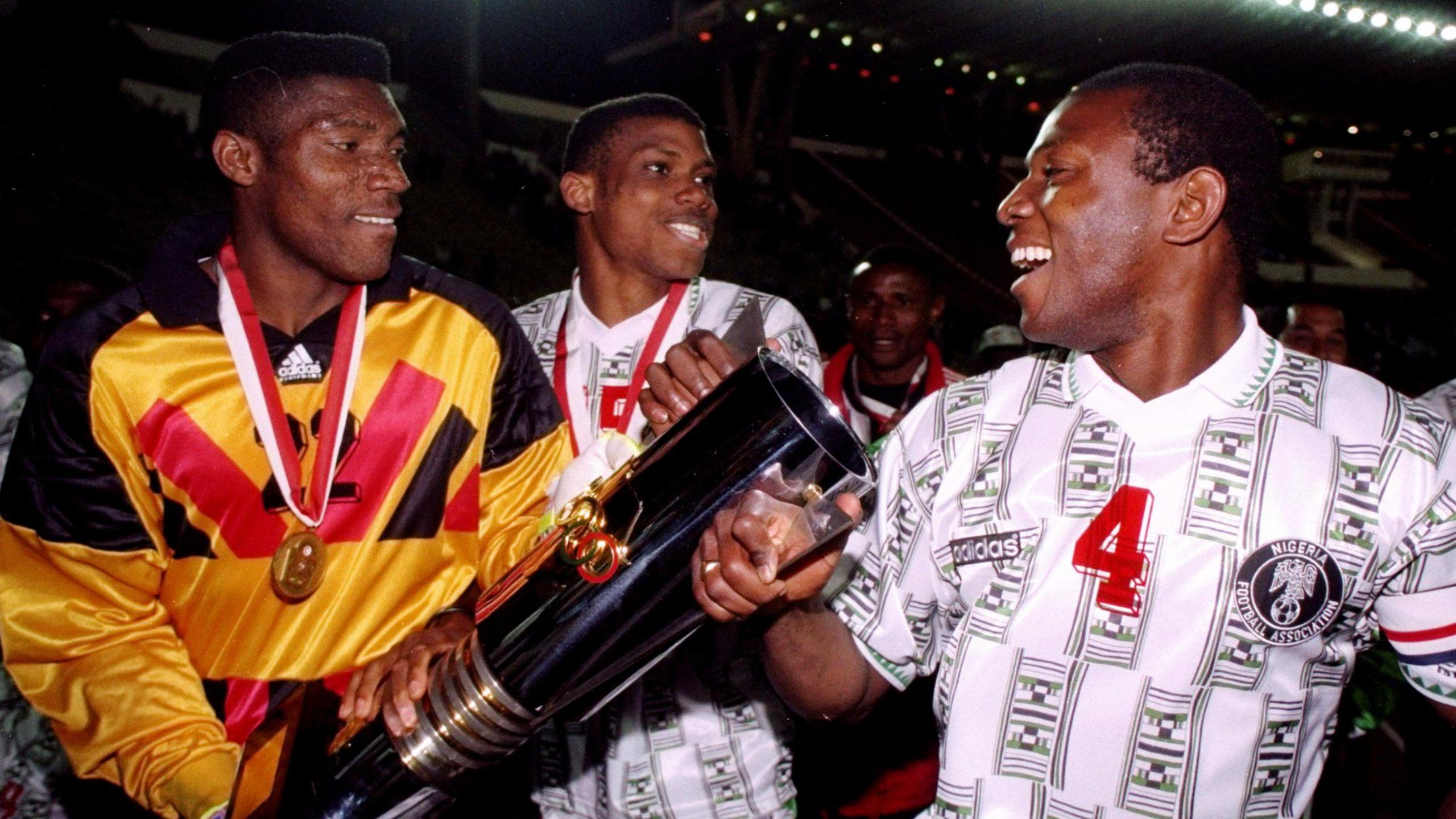Peter Rufai poses with Nigeria team-mates and the Africa Cup of Nations trophy