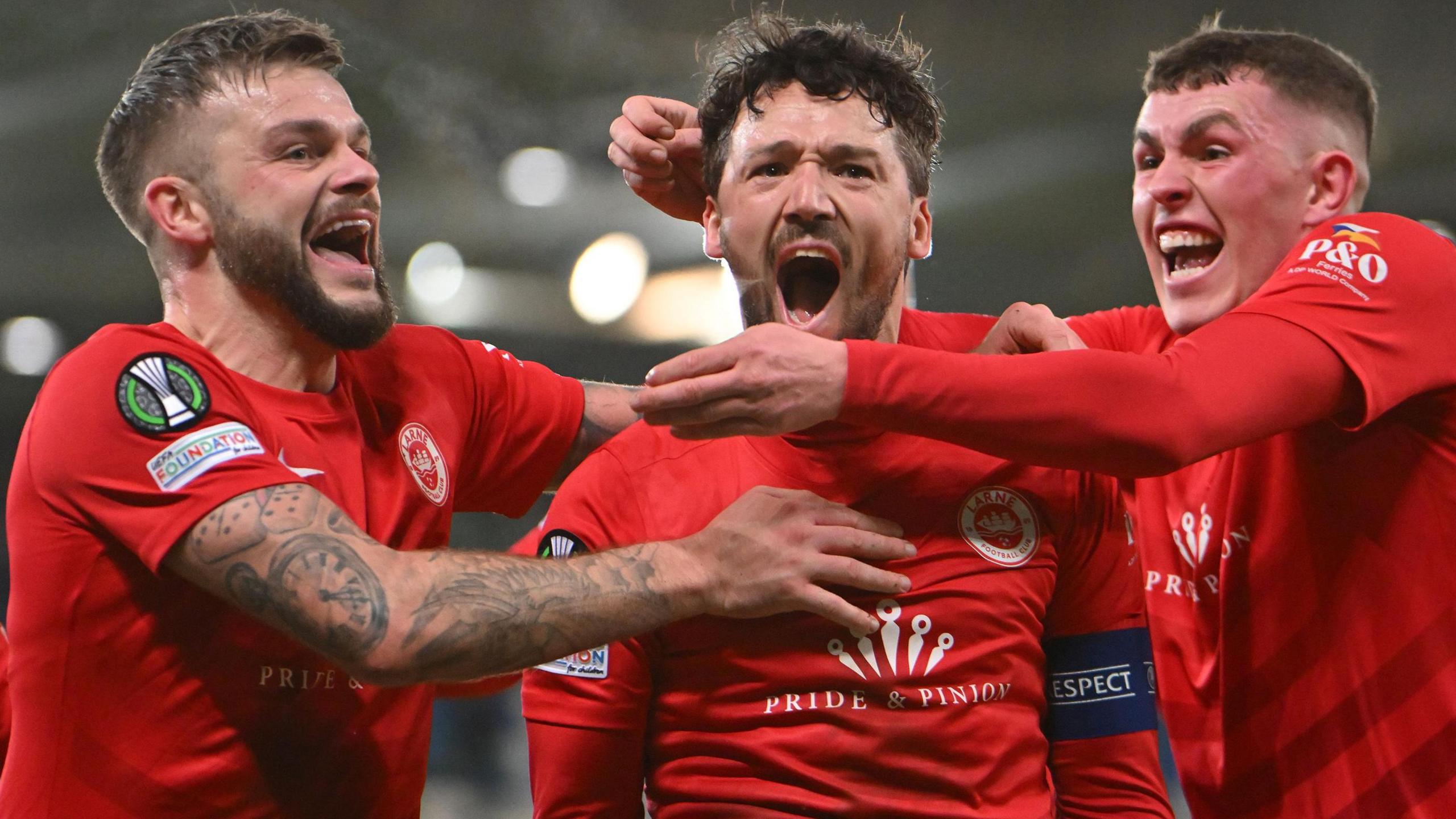 Larne celebrate their winning goal against Gent