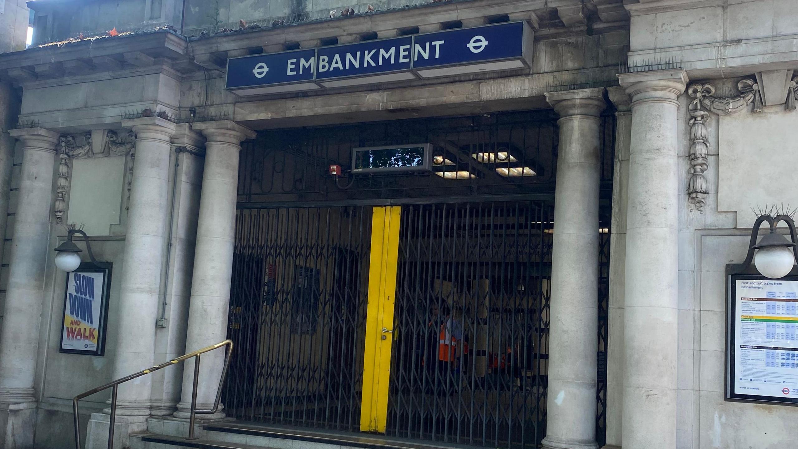 The entrance to Embankment station with gates pulled across it