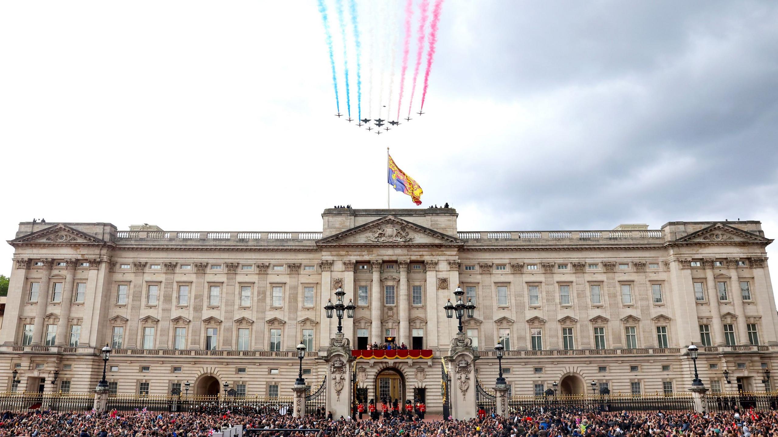 The Red Arrows fly over Buckingham Palace as the Royal Family watch from the balcony for VE Day 80 celebrations on 5 May