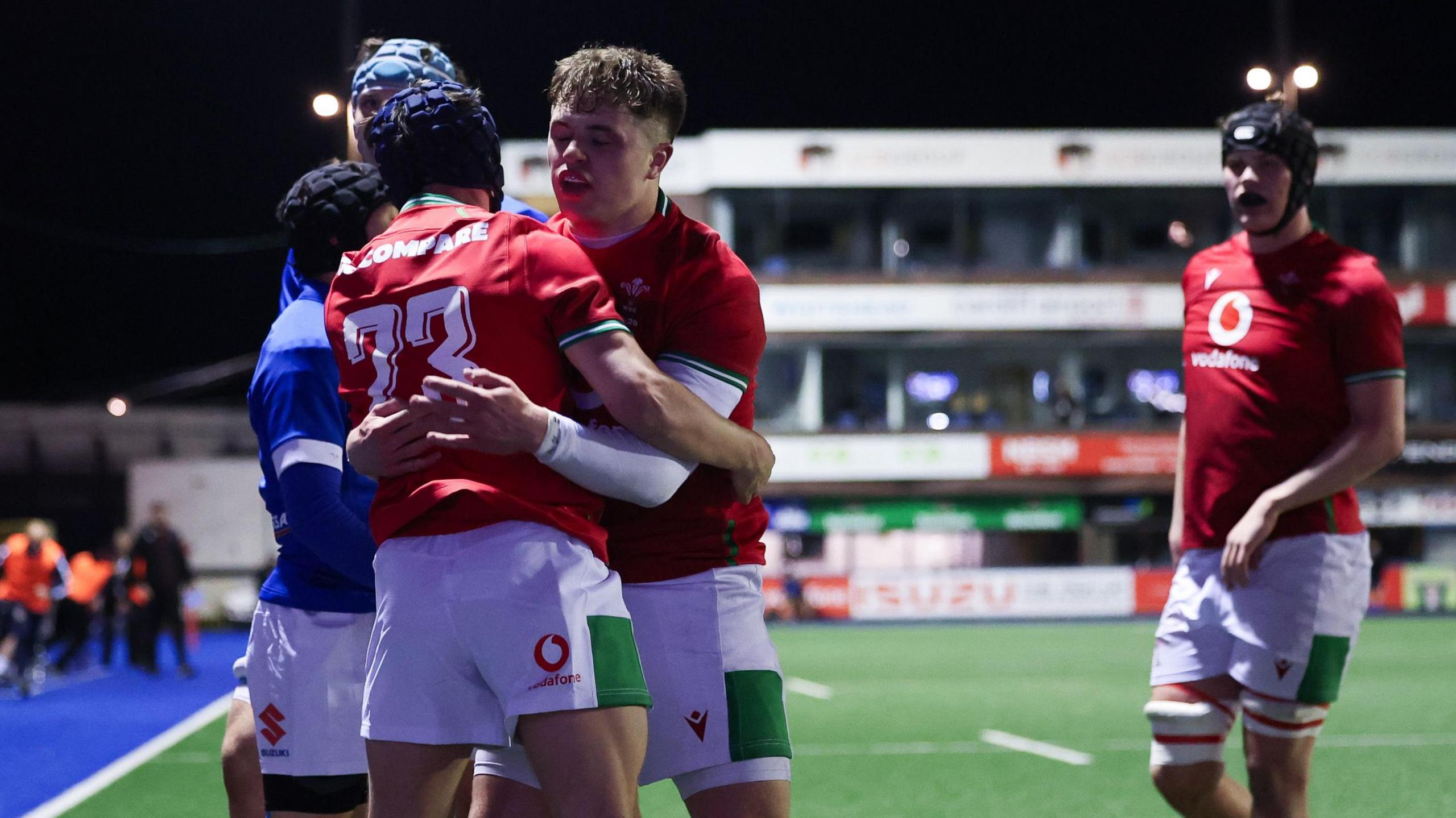 Kodi Stone of Wales celebrates scoring a try