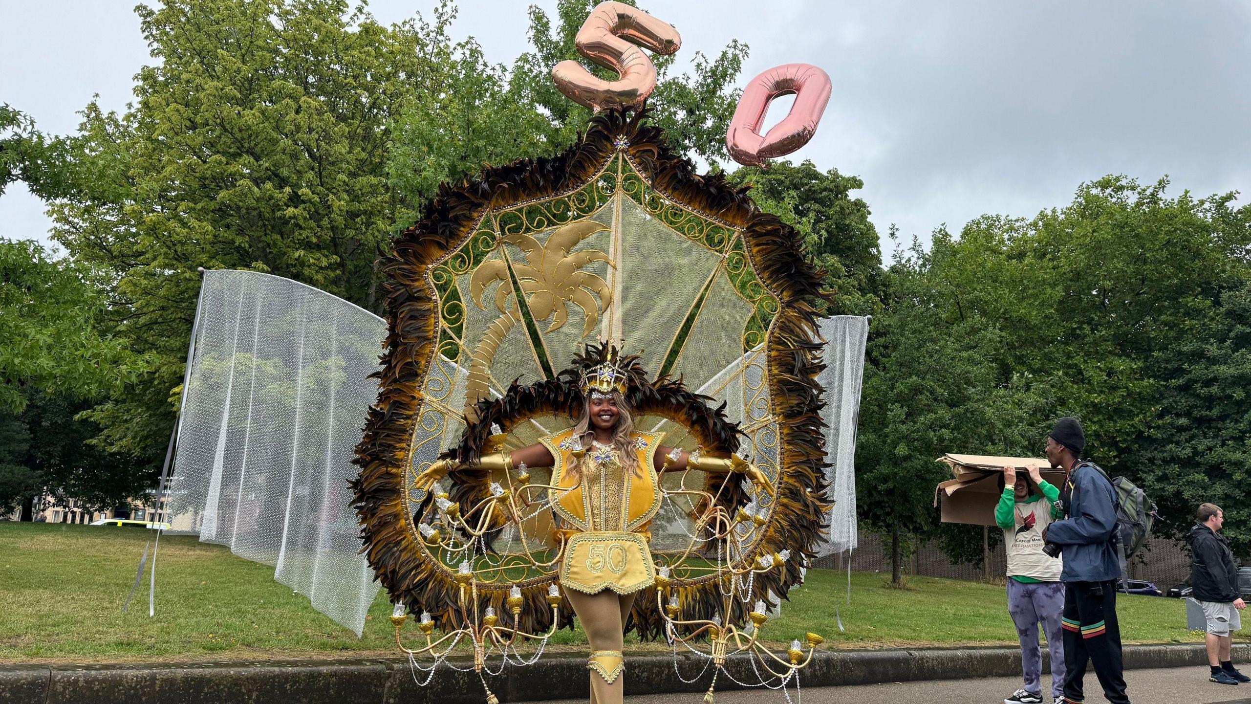 A woman in a 50th anniversary themed costume in the rain