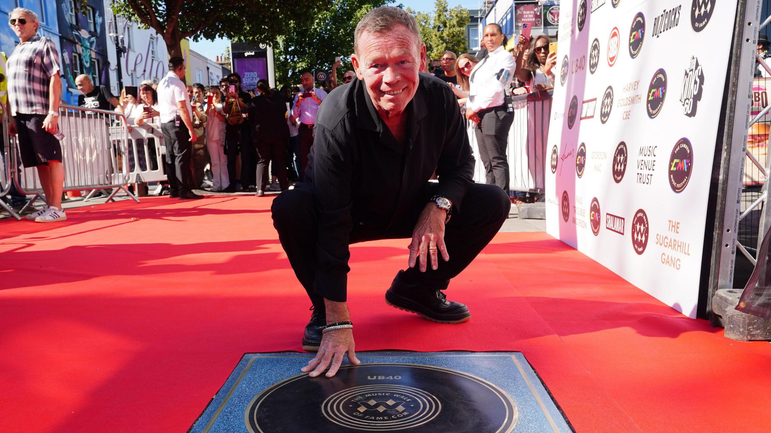 Ali Campbell unveiling a floor plaque in honour of his musical achievements in Birmingham