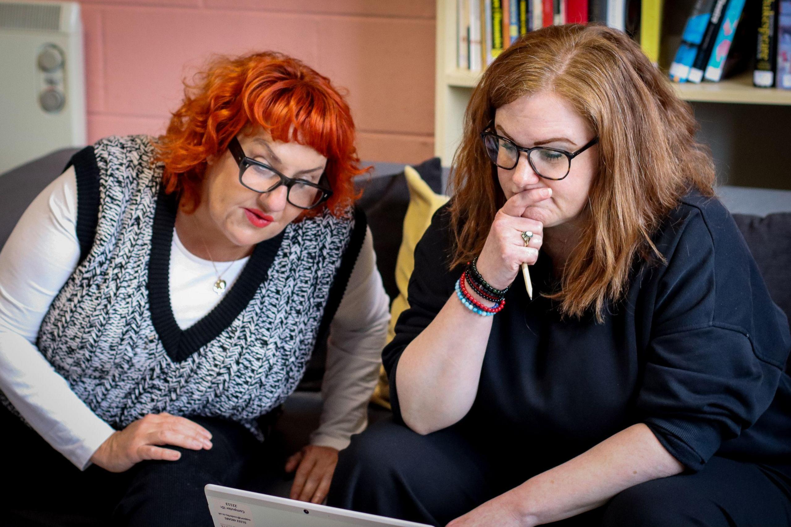 Dr Lisa McKenzie (left) and Jayne Williams looking at a laptop which is slightly out of shot