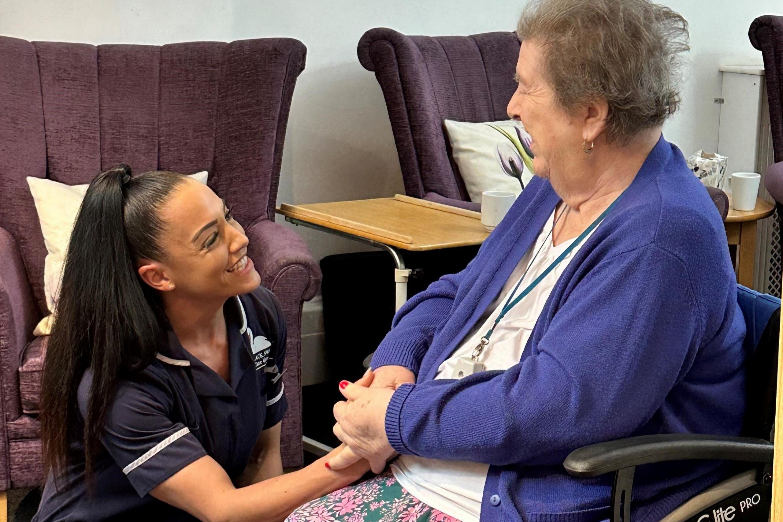 Emily Carrasquillo and a care home resident