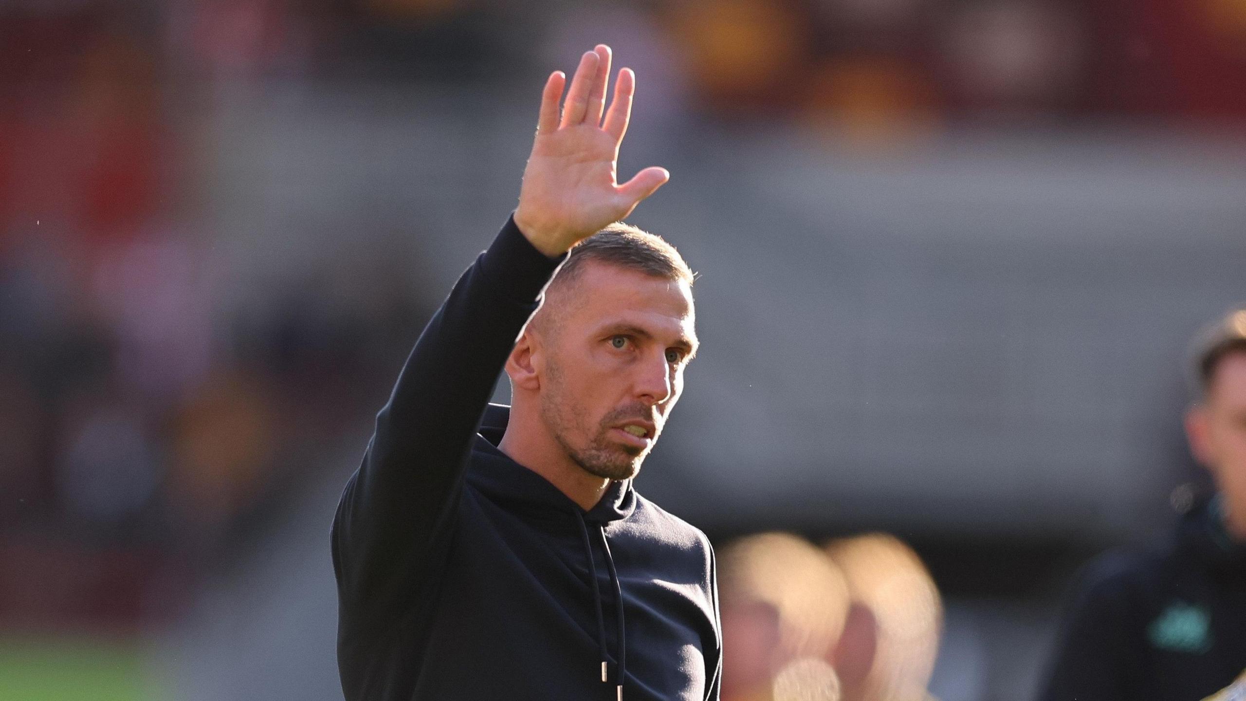 Gary O'Neil waves to fans