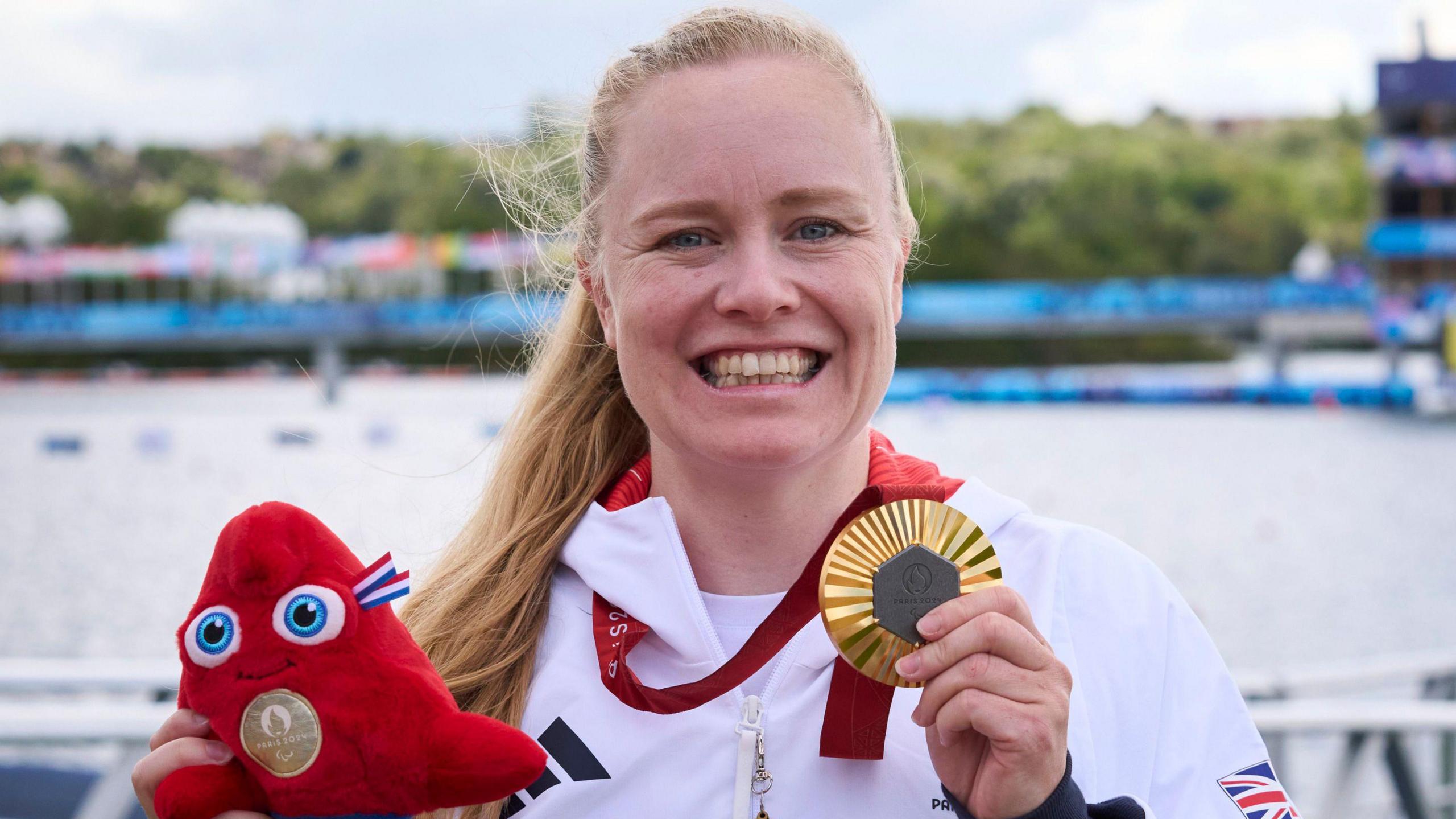 Great Britain's Paralympic athlete Laura Sugar celebrates with her gold medal in Paris