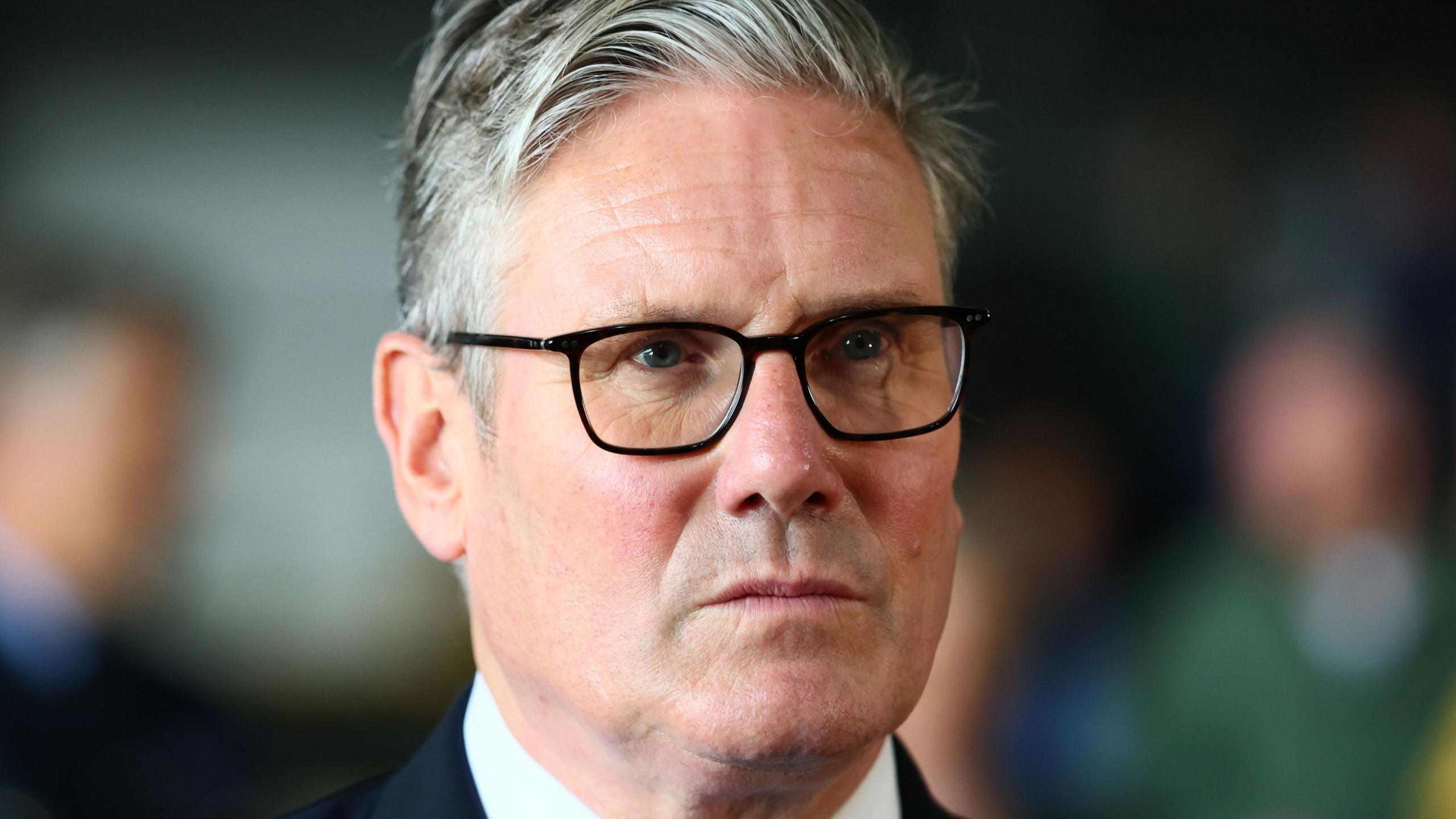 Sir Keir Starmer looks into the distance in a close-up.
