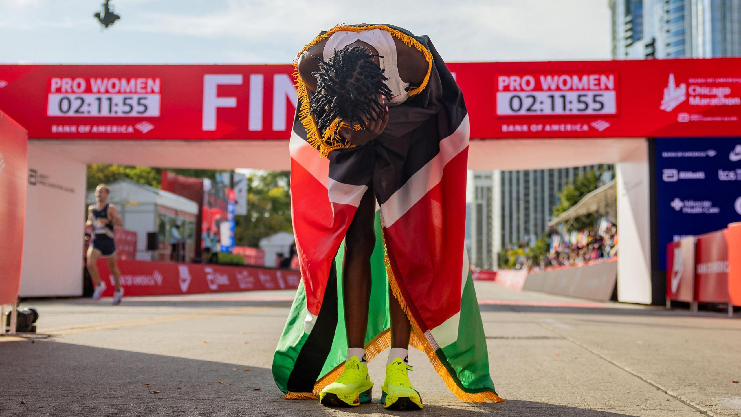 Ruth Chepngetich slumps in the finish area of the Chicago Marathon