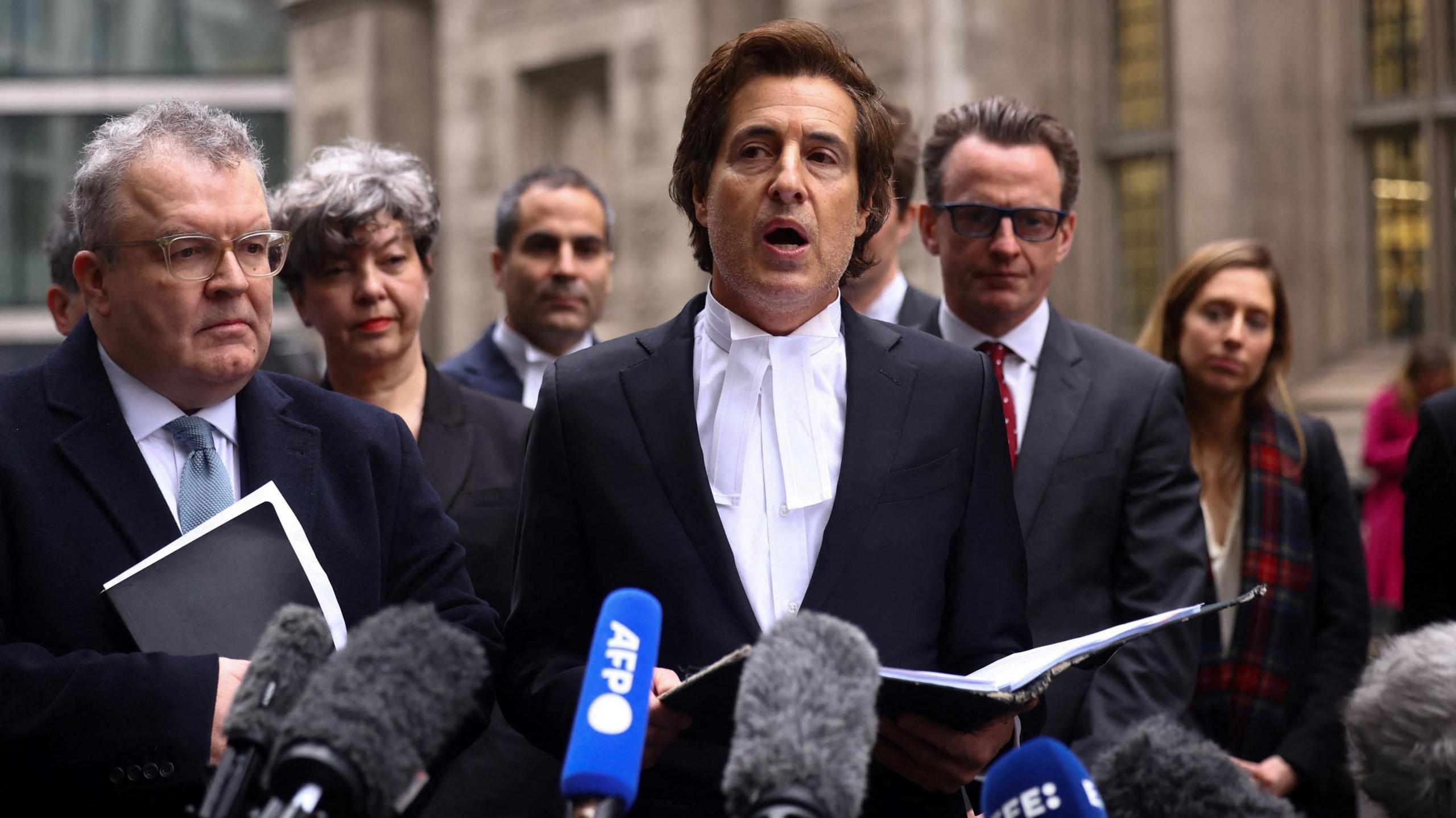 Lawyer David Sherborne read a statement outside court where the case would have been held