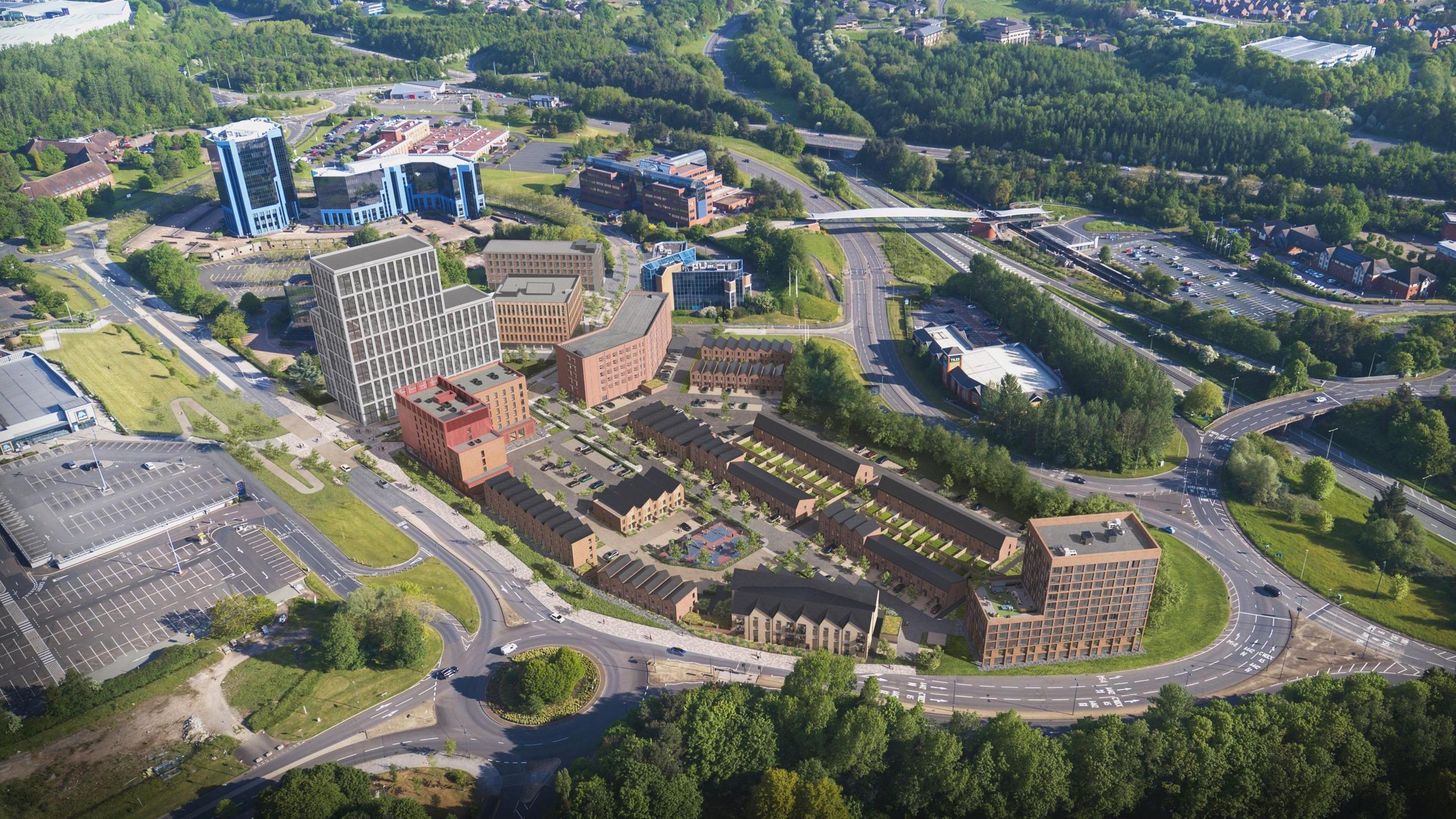 A computer generated graphic of a town centre residential and commercial development, showing rows of town houses and a hotel, surrounded by roads and trees, with a car park nearby