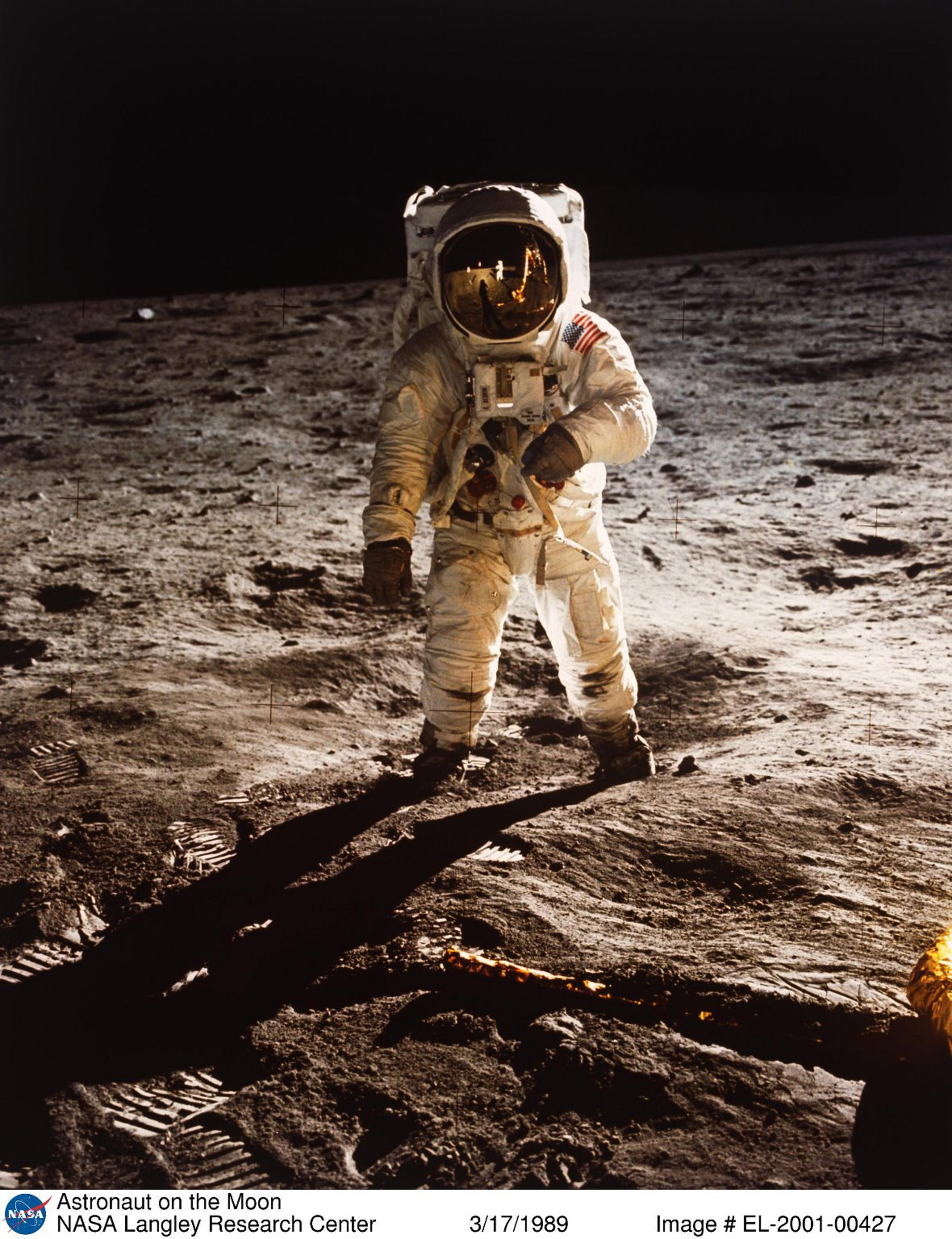 Astronaut Buzz Aldrin walks on the surface of the Moon