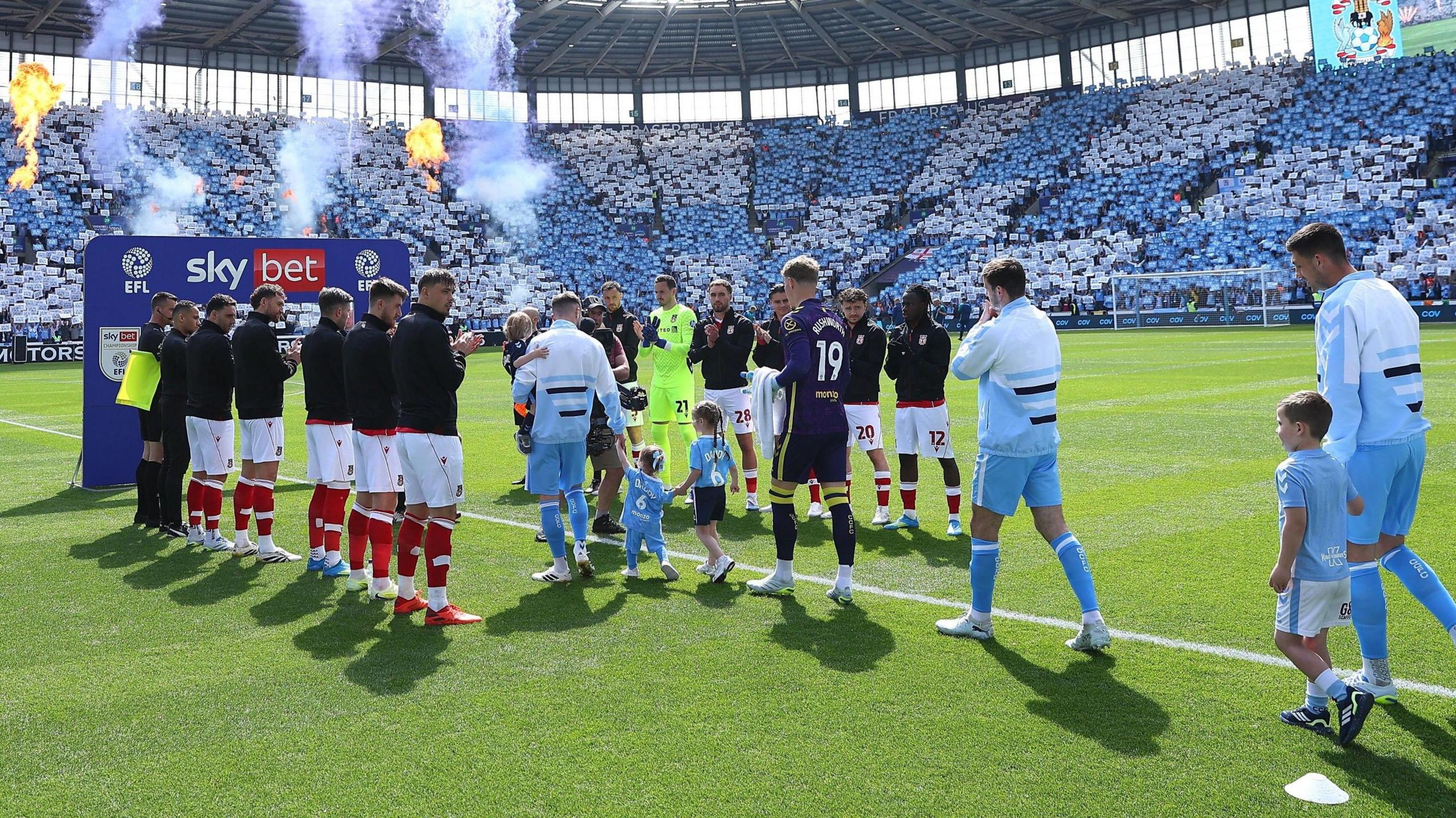 Wrexham players give Coventry City players a guard of honour