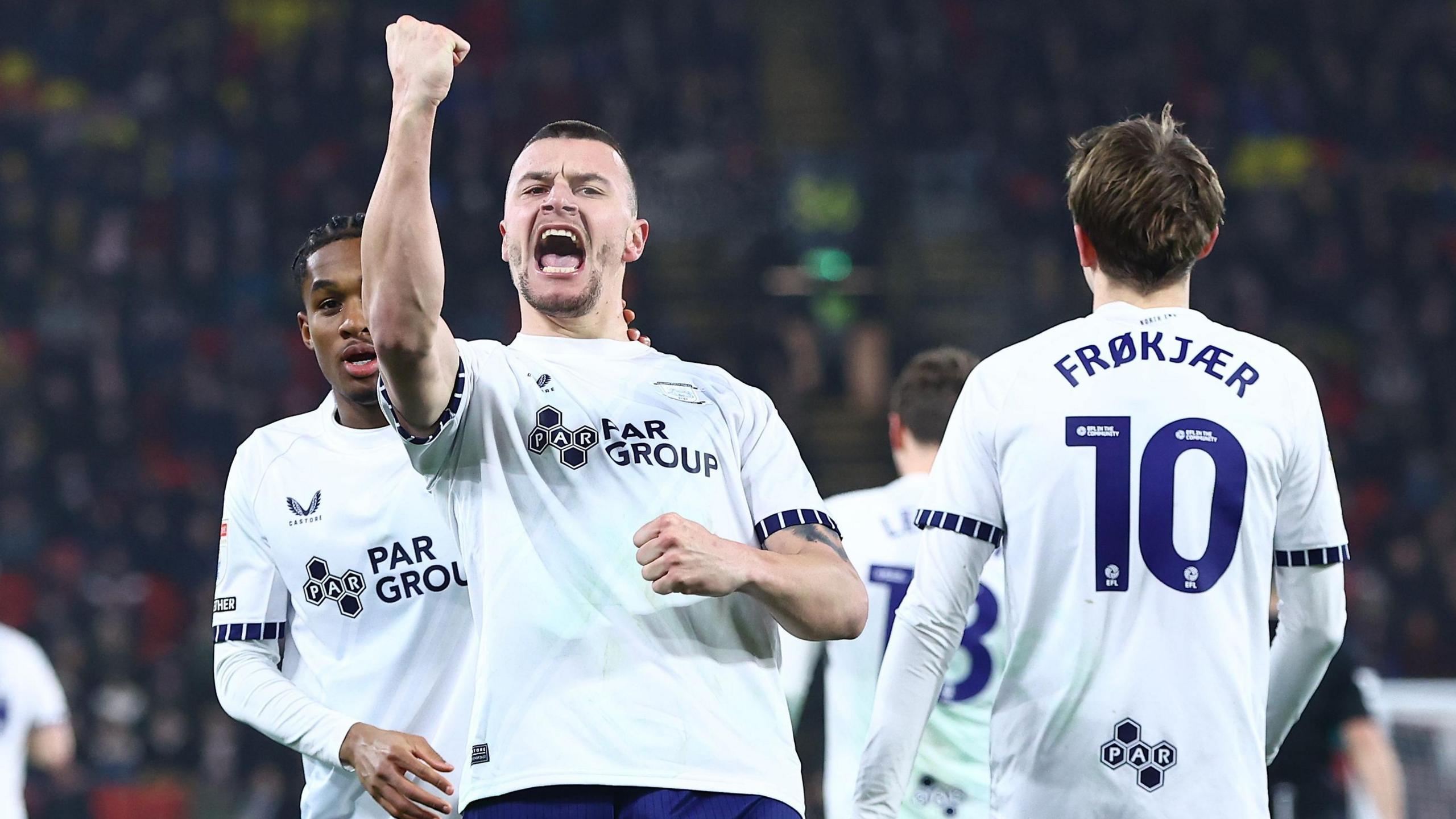 Preston North End striker Milutin Osmajic punches the air in celebration after scoring his second goal at Watford