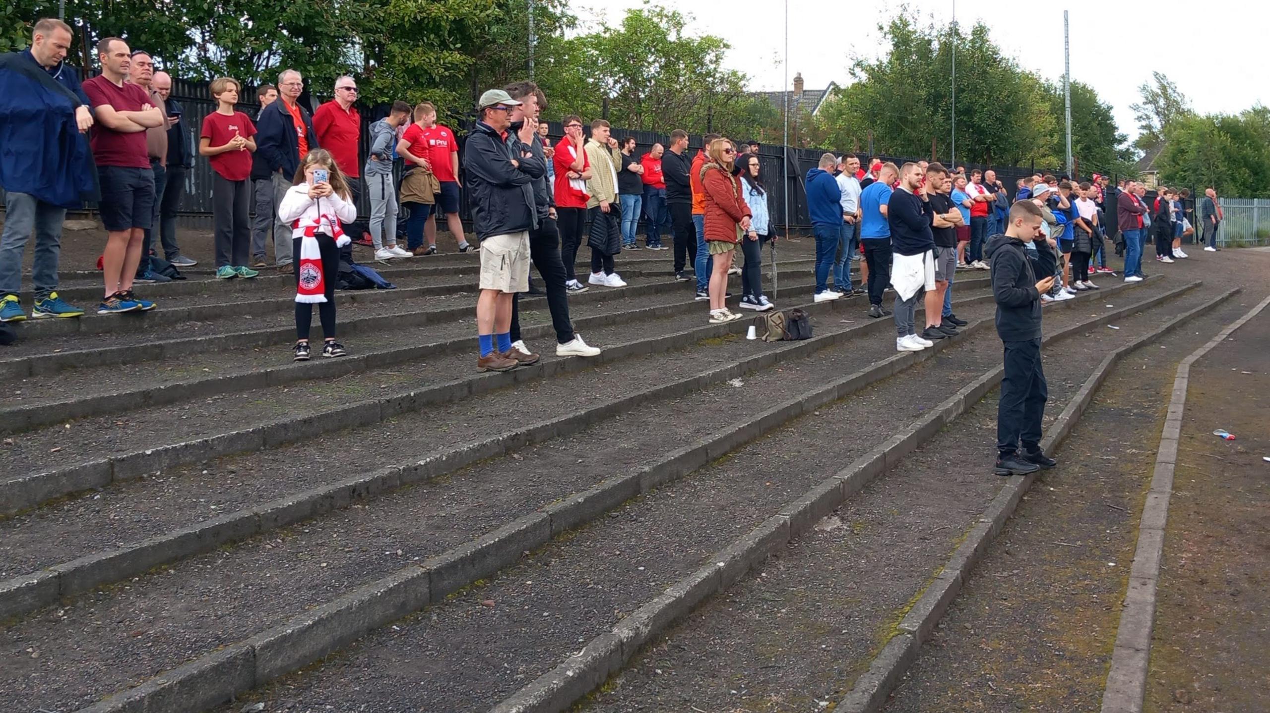 Fans on the terrace at Alloa Athletic's Recreation Park stadium.