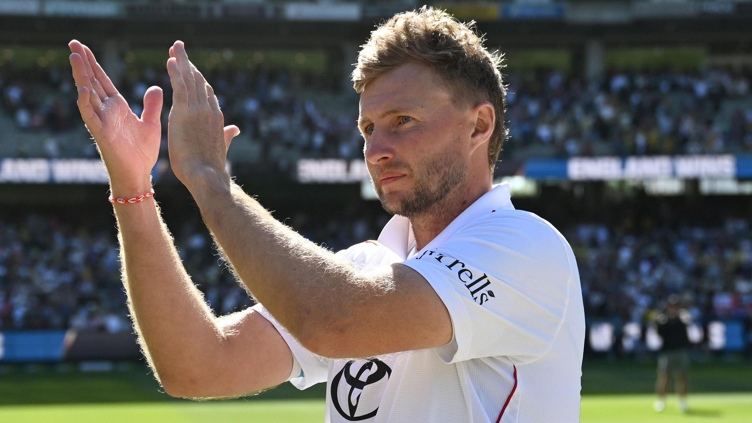 Joe Root claps supporters