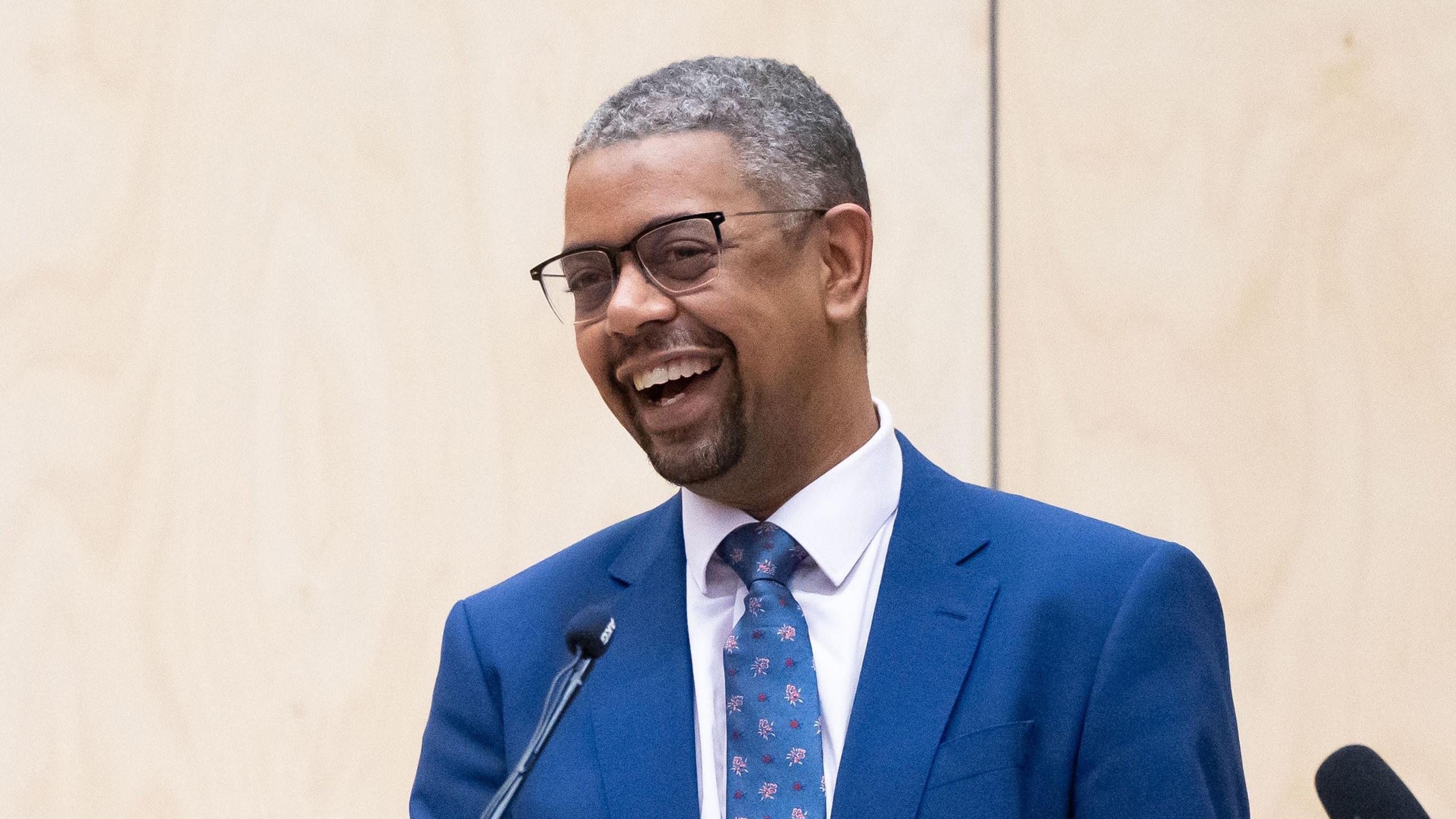 Vaughan Gething smiling while wearing a blue suit