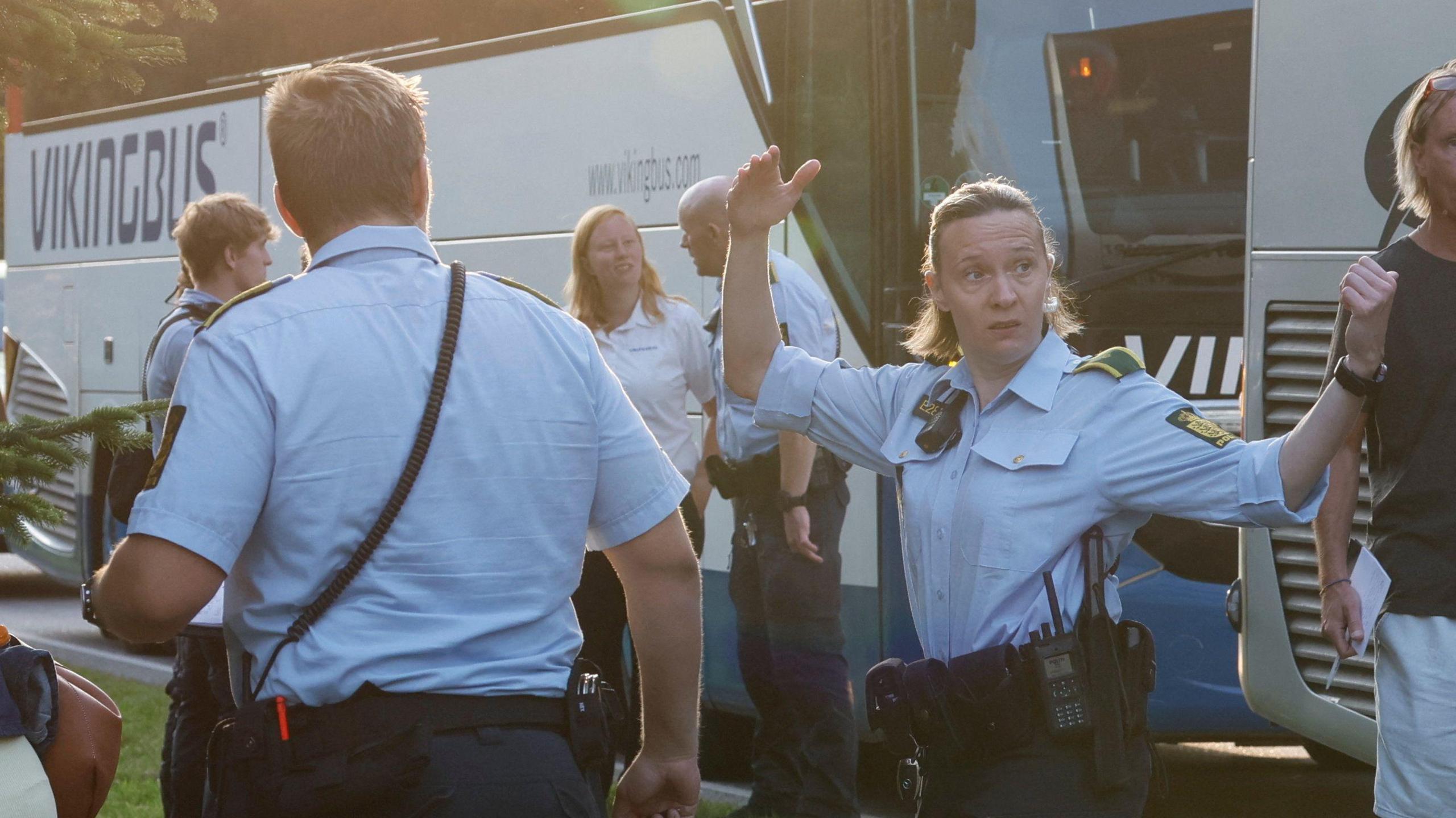 Danish police direct people involved near the derailment