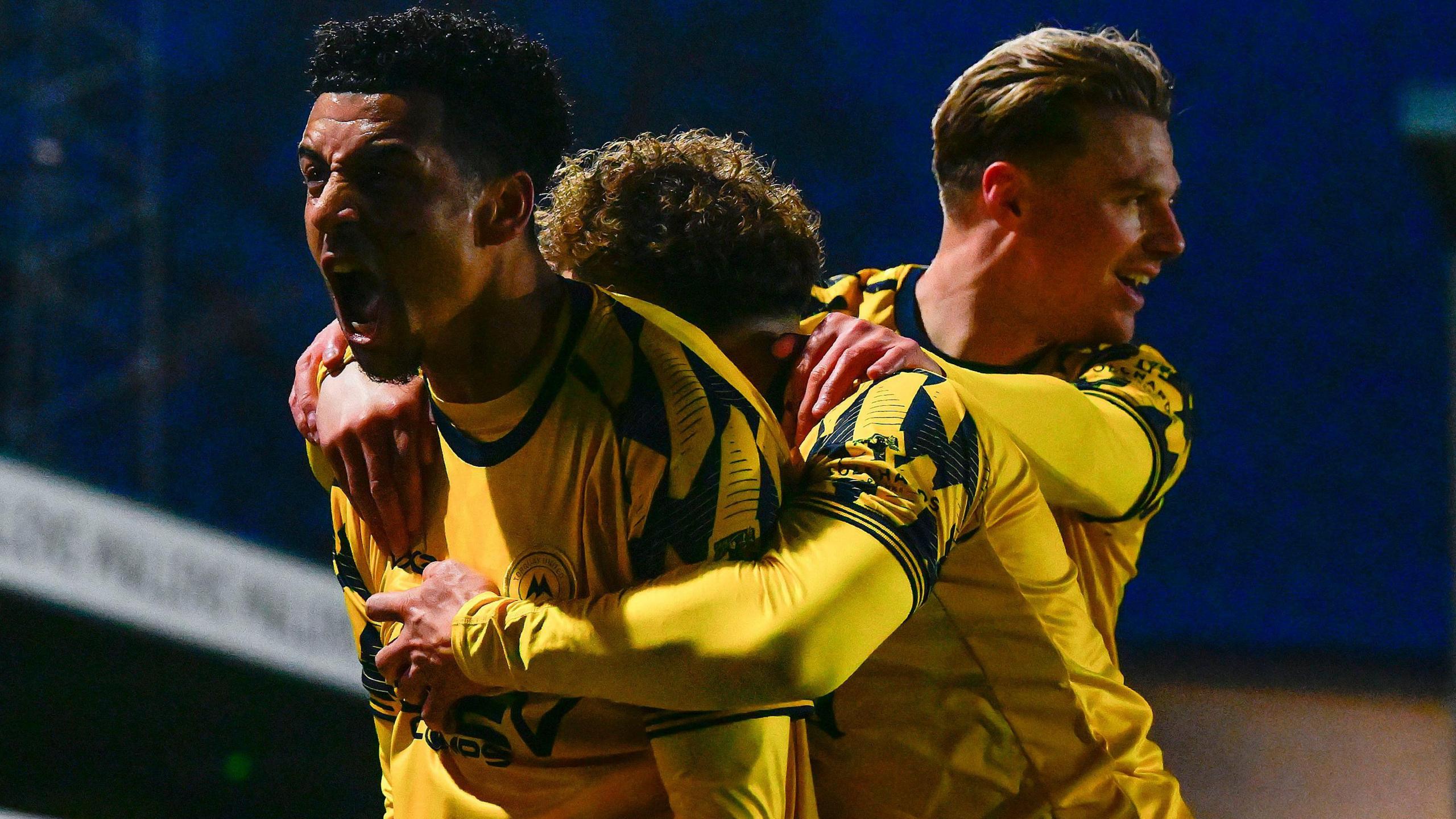 Louis Dennis celebrates continuing his remarkable goalscoring form for Torquay United