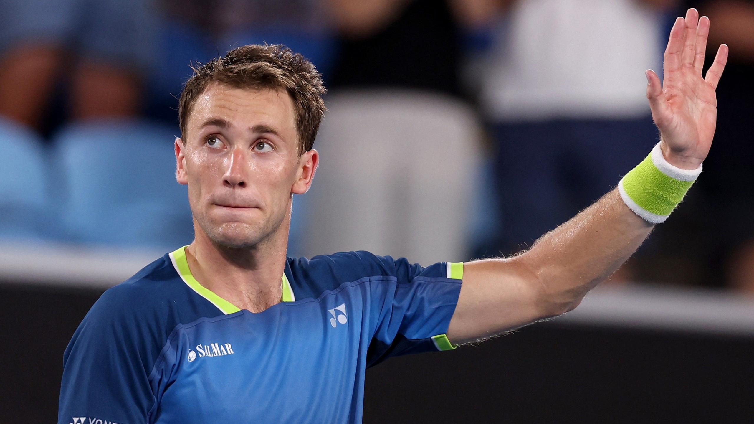 Casper Ruud waves to the crowd on Margaret Court Arena