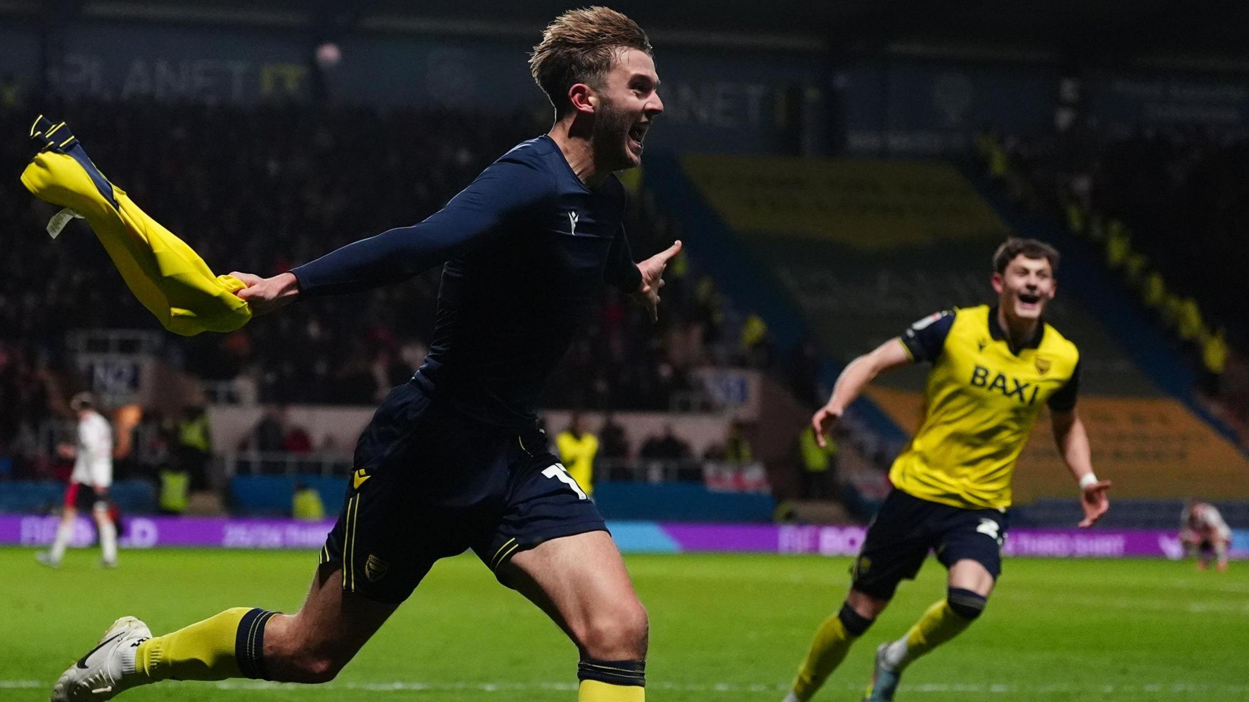 Stan Mills celebrates for Oxford United