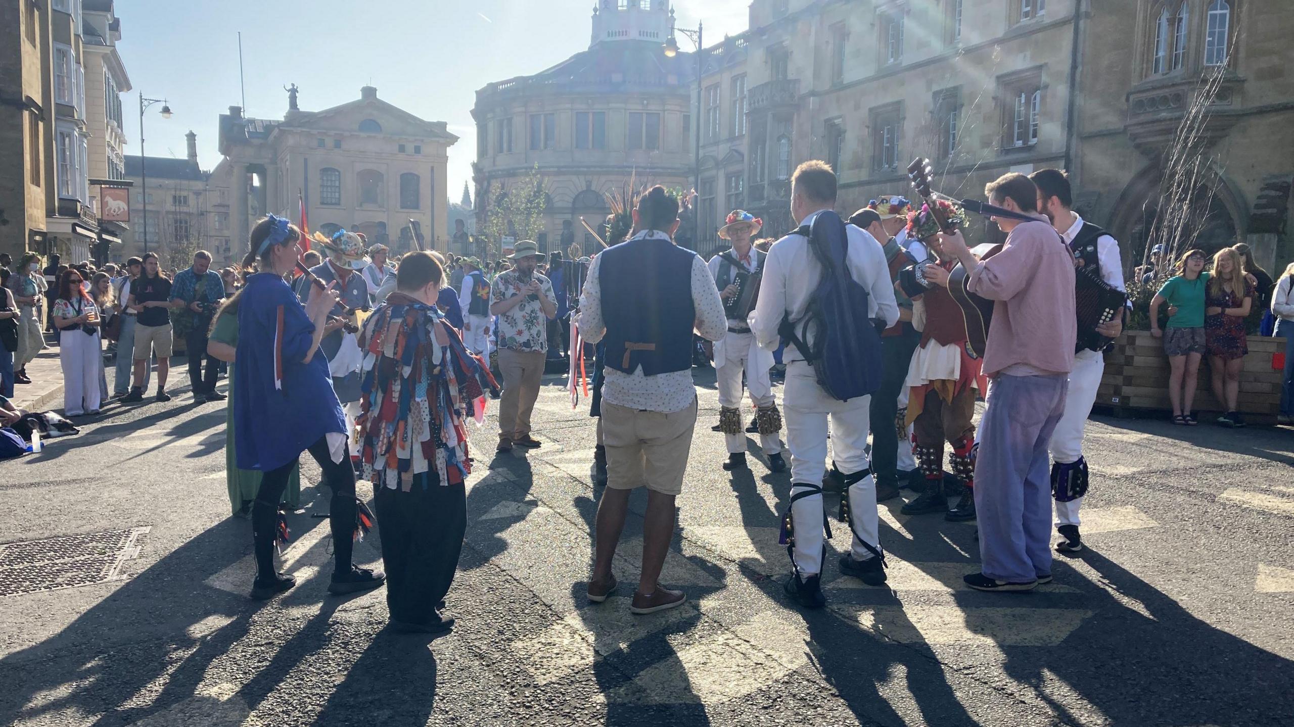 People gathered around playing music
