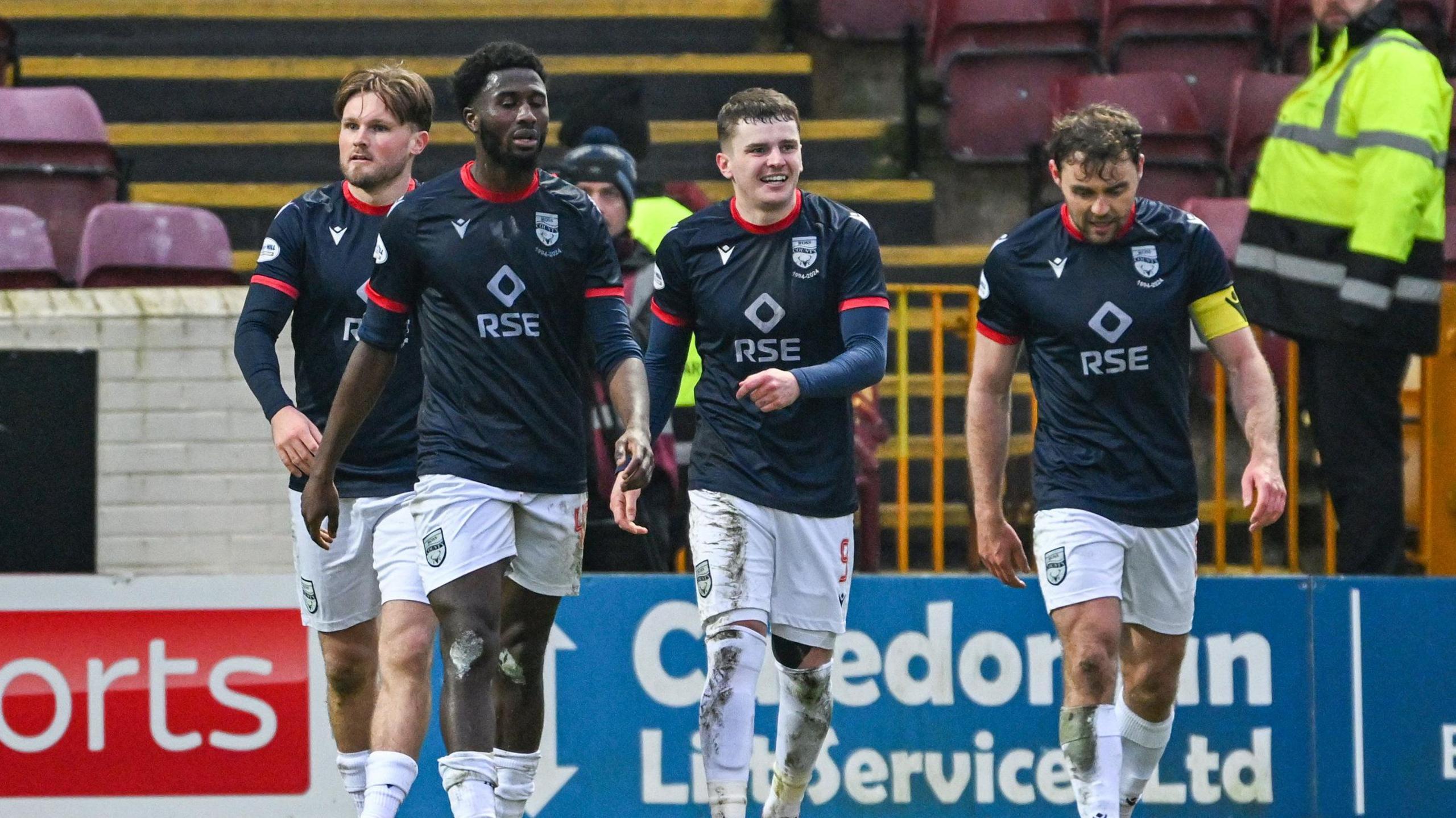 Ronan Hale celebrates his second goal with his teammates