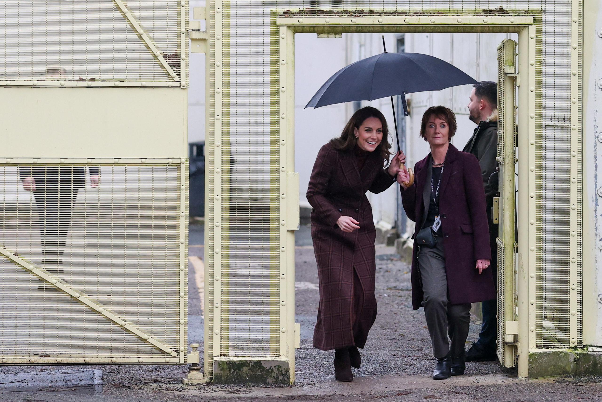 The Princess of Wales was escorted inside the gates of HMP Styal in Cheshire, sheltering under an umbrella.