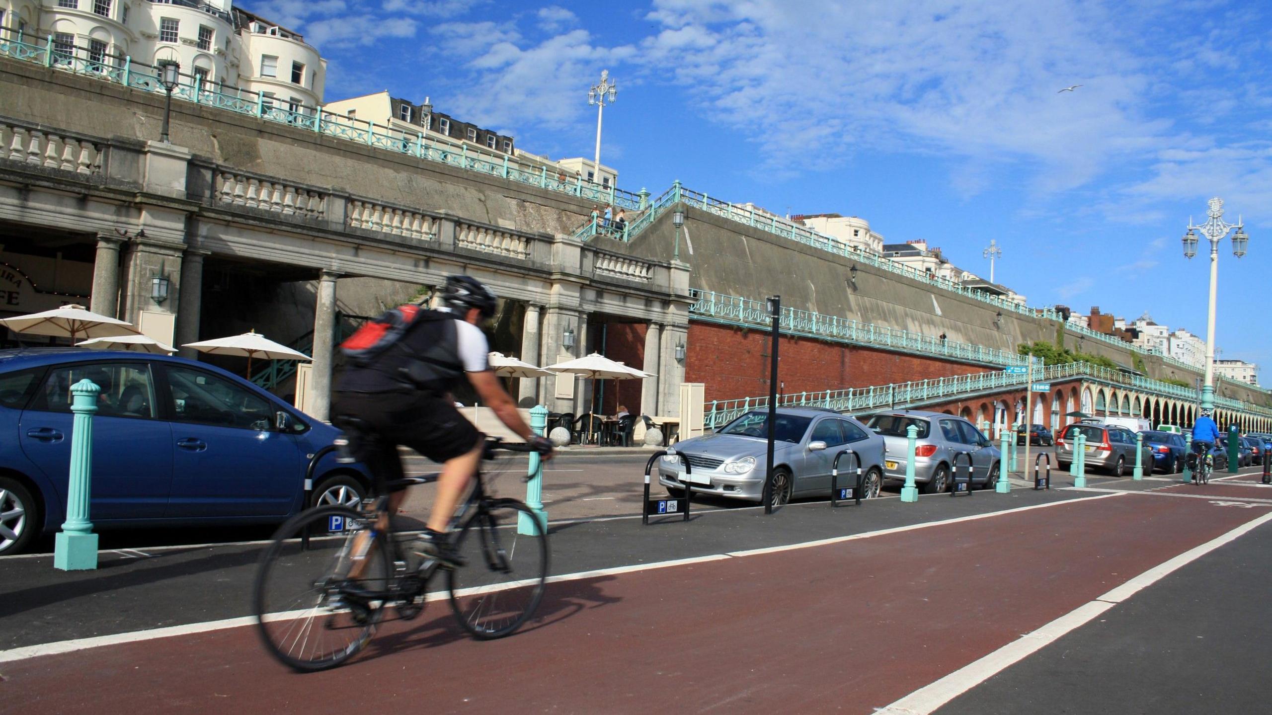 A cyclist rides along a cycle lane in Brighton.