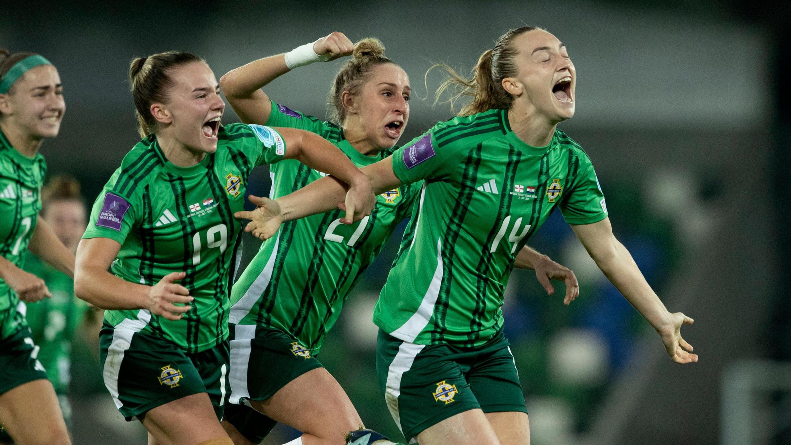 The women's Northern Ireland team celebrate and cheer