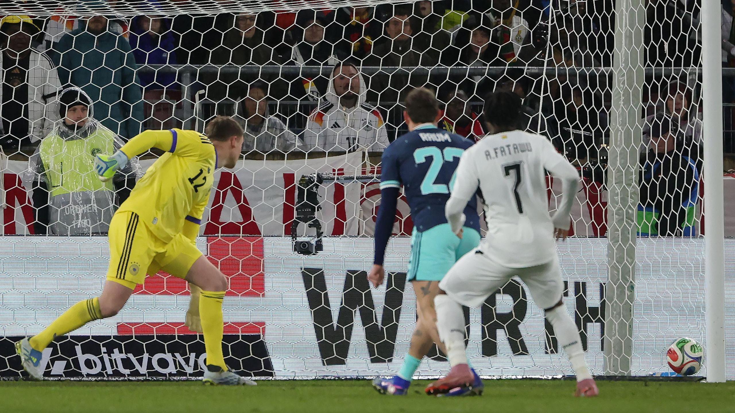 Abdul Fatawu in an all white Ghana kit scores against Germany