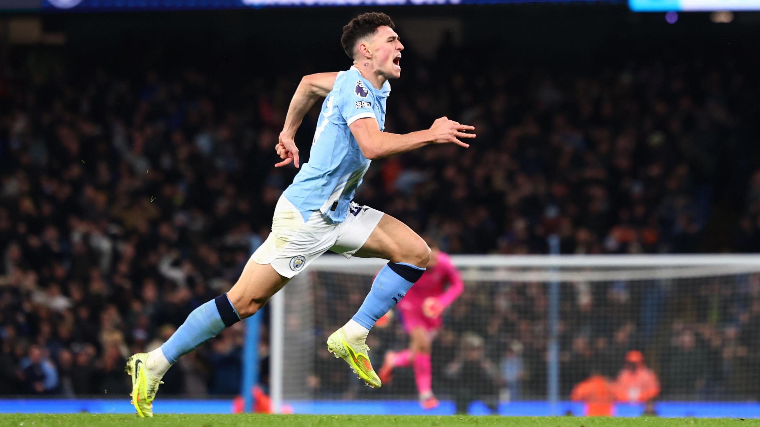 Phil Foden of Manchester City celebrates after he score