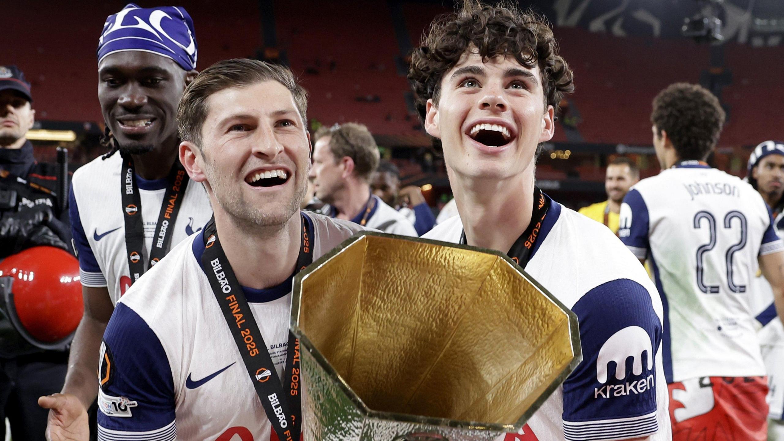 Tottenham's Ben Davies and Archie Gray lift the Europa League trophy