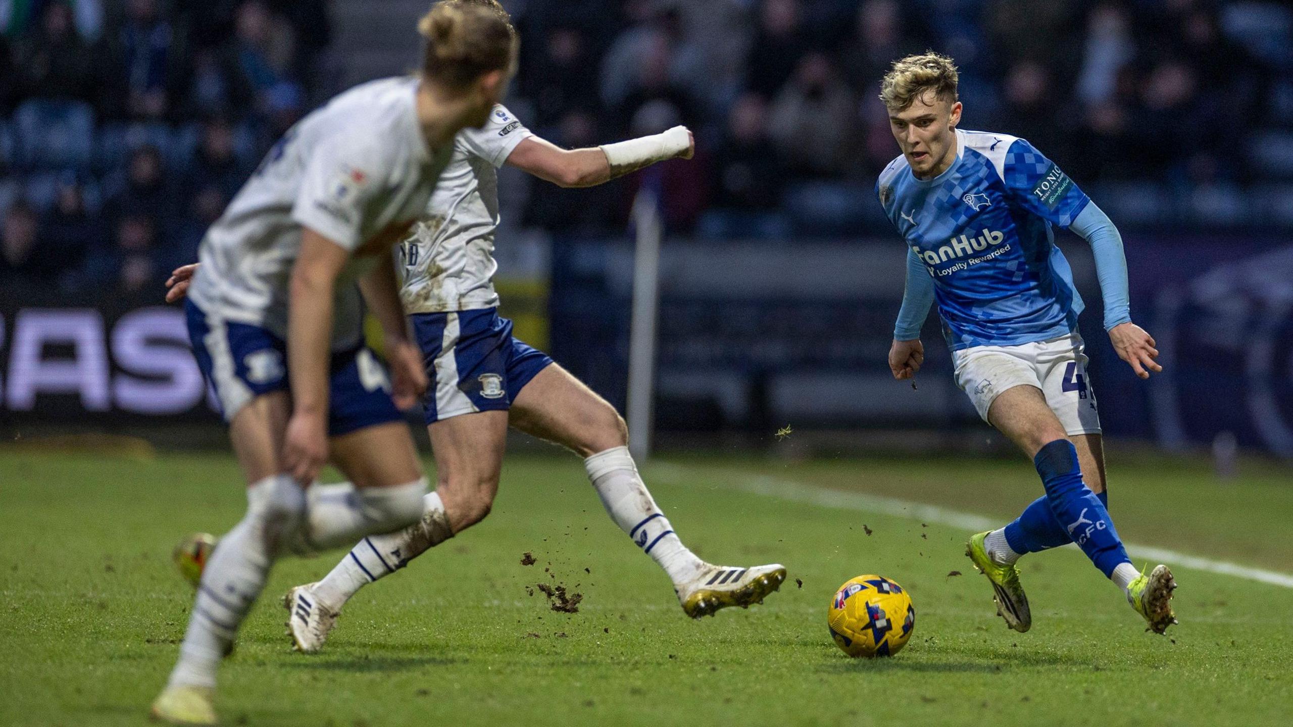 Derby's Bobby Clark is on the ball with two Preston players ahead of him