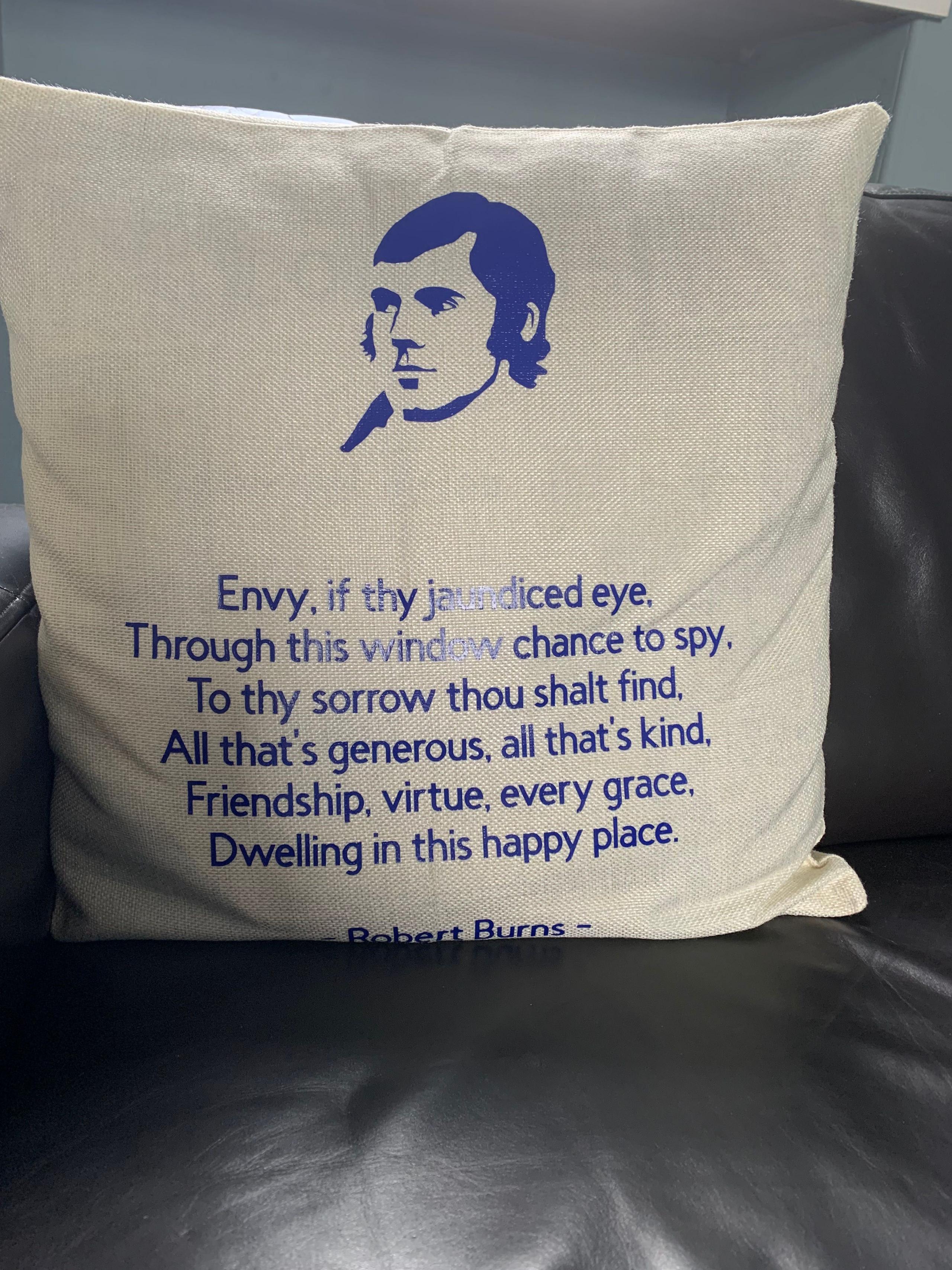 A cushion carrying the words from the Robert Burns poem At Whigham's Inn on it