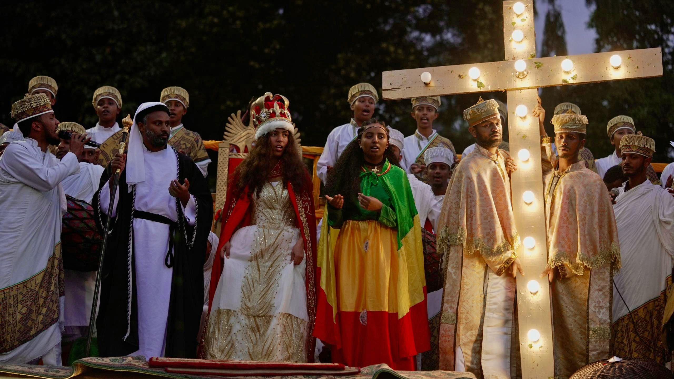 Sunday school students act out a religious scene to mark the Ethiopian Orthodox holiday of Meskel, in Addis Ababa, on September 26, 2024. 